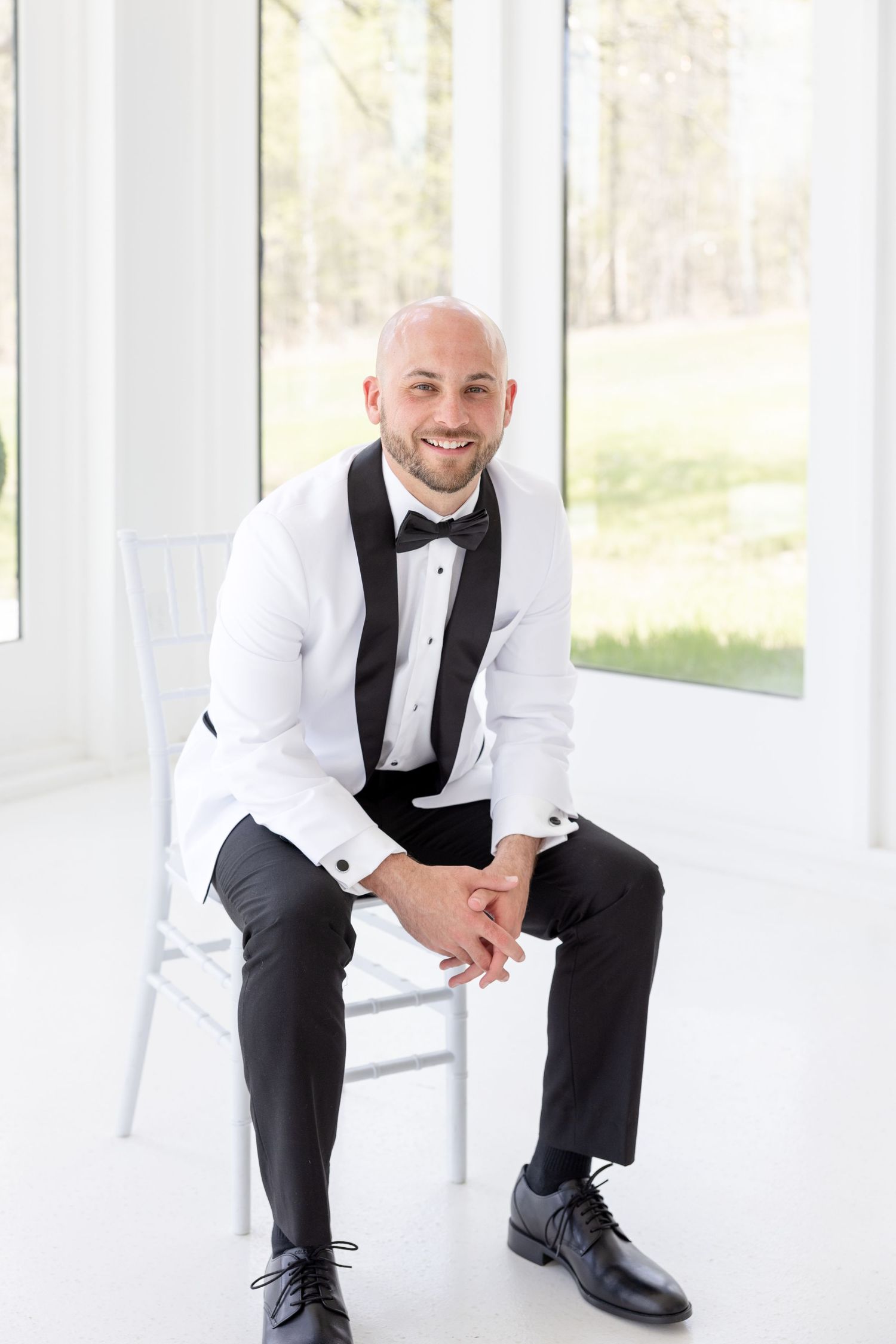 Light and airy wedding photos at The Glass House near Huntsville, Alabama capturing joyful, timeless moments of a bride and groom