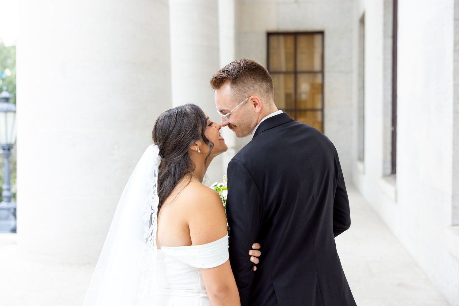Bride and groom portraits at the Ohio Statehouse in downtown Columbus, Ohio, captured with timeless, light and airy wedding photography.