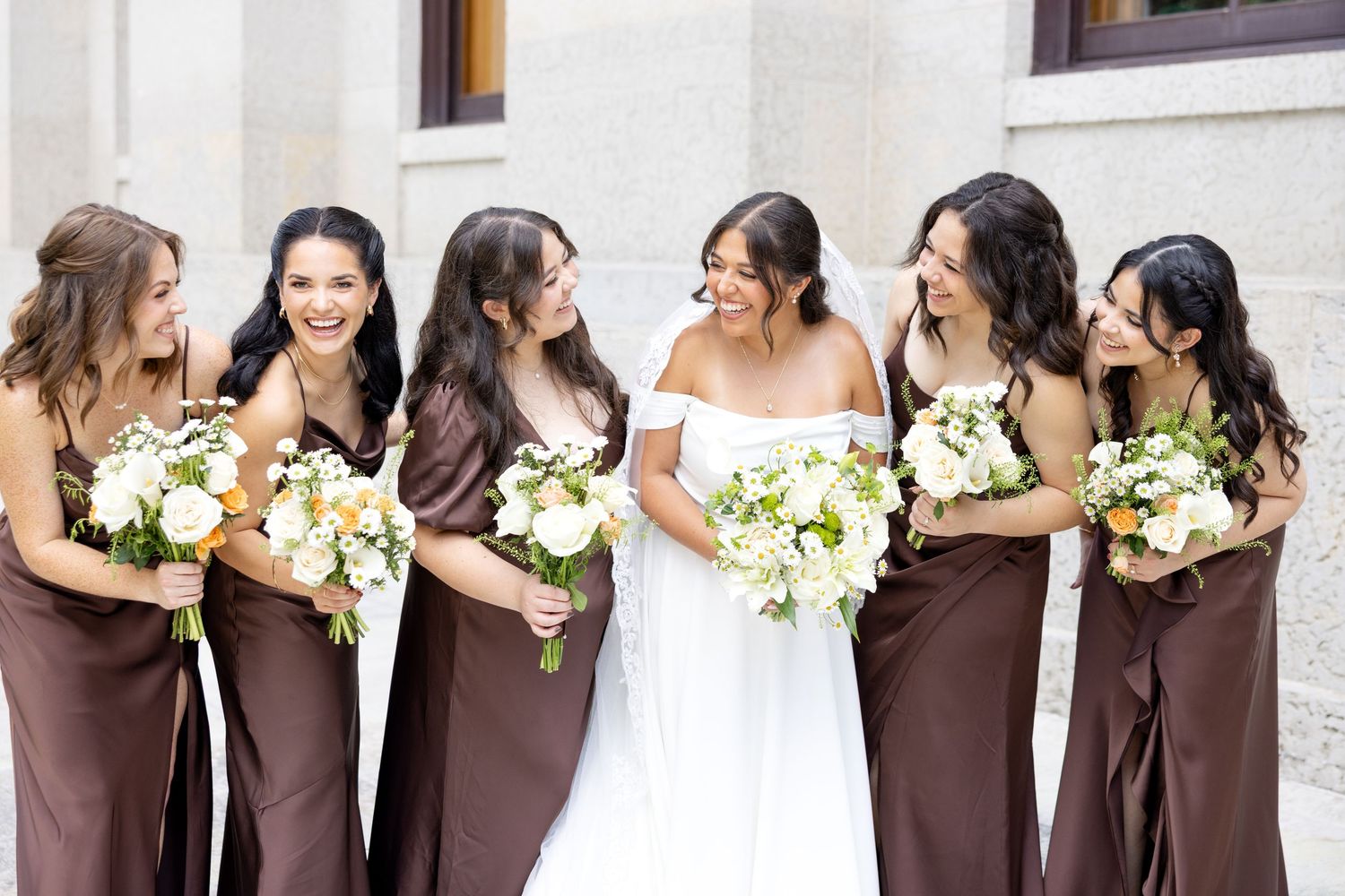 Bride and groom celebrating their Flat 51 wedding in downtown Columbus, Ohio, captured with timeless, light and airy wedding photography.