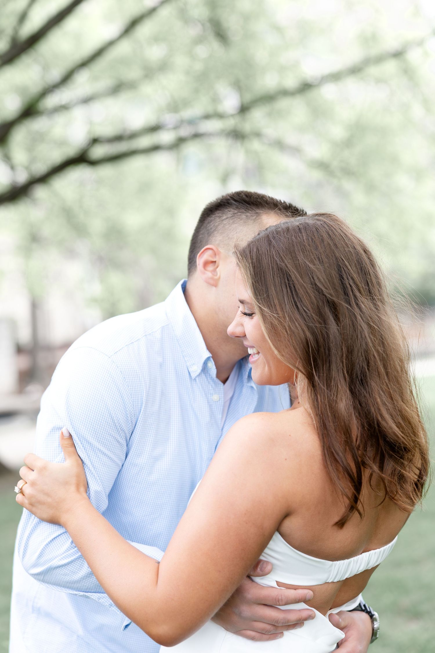 Downtown Huntsville engagement session at First National Bank and Big Spring Park by Julia and Sean Photography, capturing joyful moments.