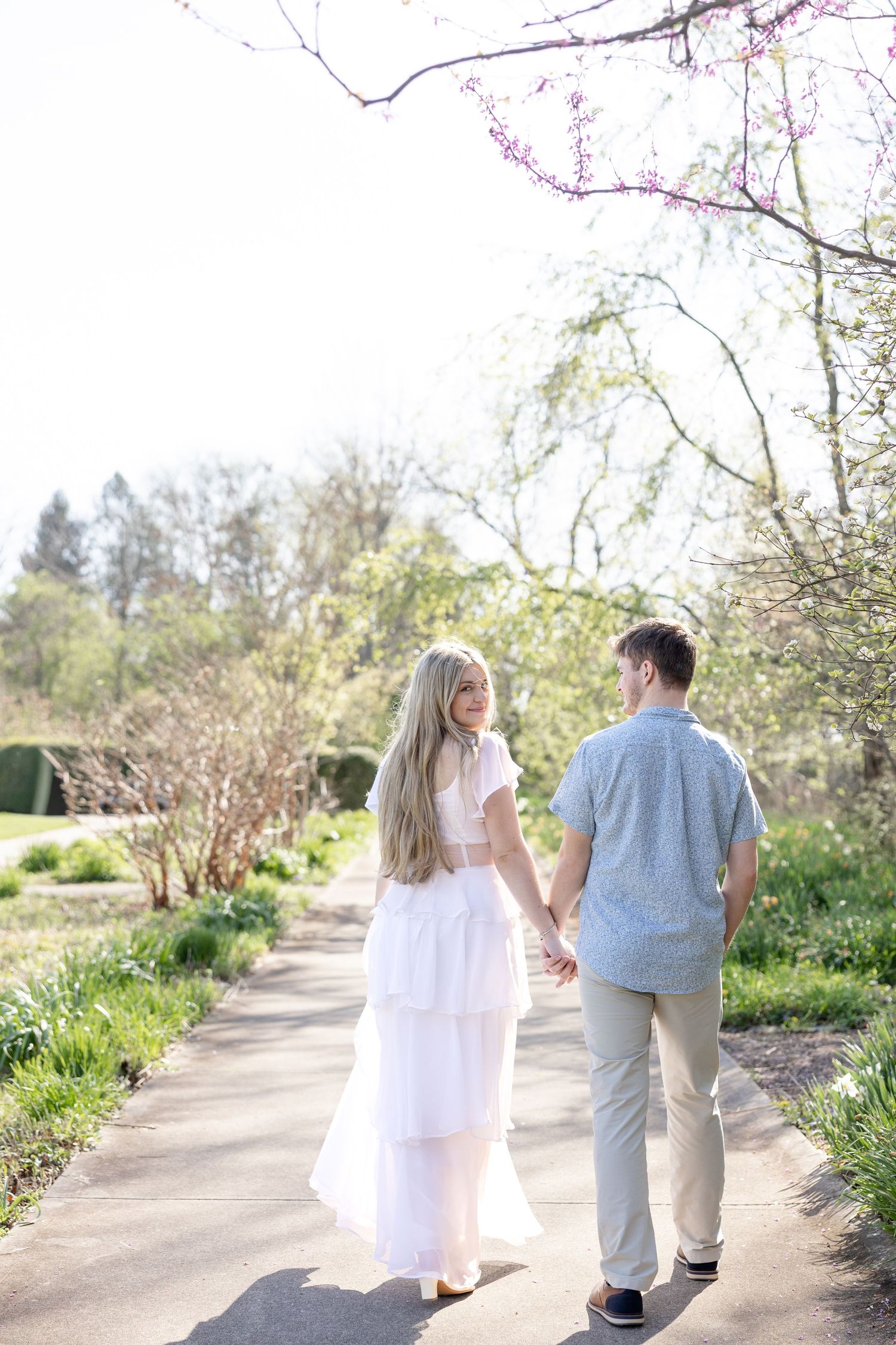 Cincinnati engagement session at Ault Park with light and airy style, capturing joyful, natural moments in a spring park setting