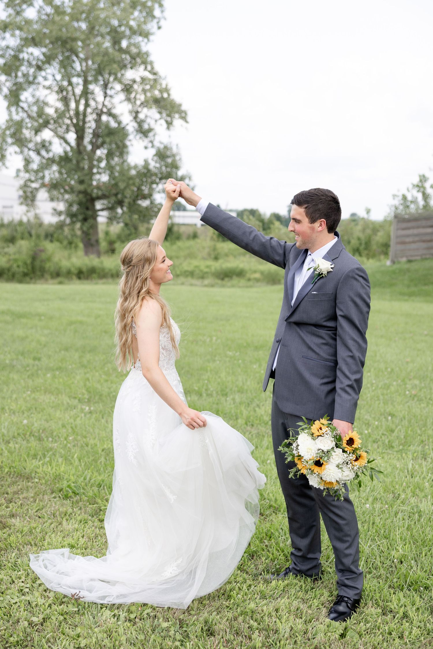 Joyful summer wedding at The Bicentennial Barn in Dayton, Ohio, photographed by Dayton wedding photographers Julia and Sean Photography.