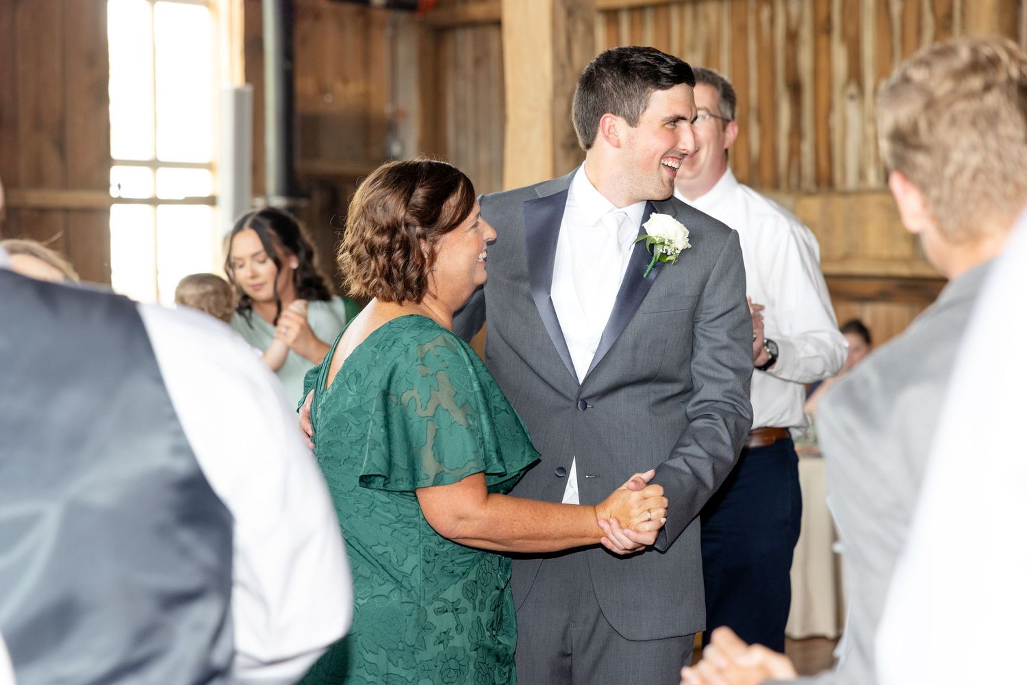 Joyful summer wedding at The Bicentennial Barn in Dayton, Ohio, photographed by Dayton wedding photographers Julia and Sean Photography.