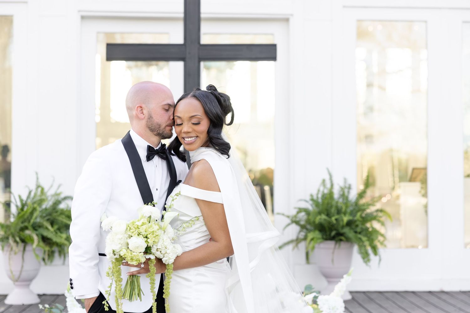 Light and airy wedding photos at The Glass House near Huntsville, Alabama capturing joyful, timeless moments of a bride and groom