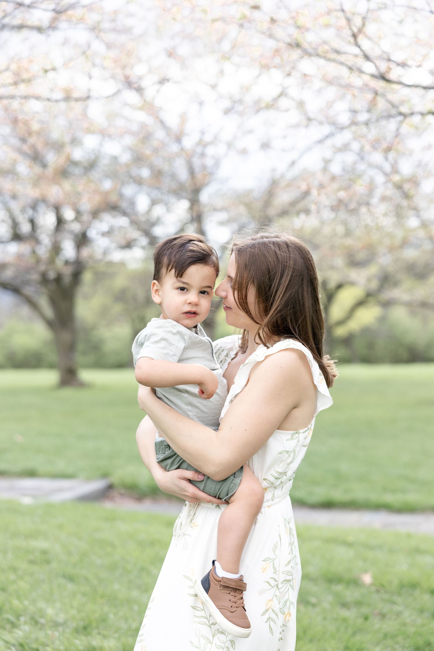 Mother holding her baby during a timeless motherhood session at Carillon Park in Dayton Ohio with Julia and Sean Photography