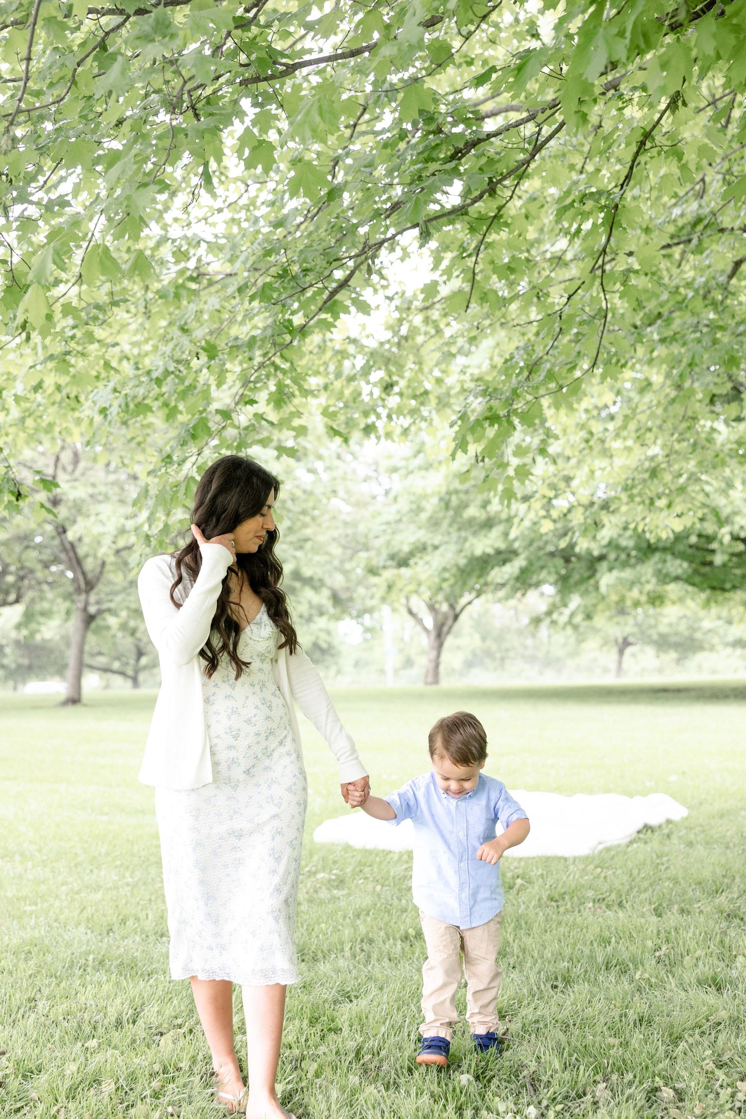 Joyful motherhood photos at Carillon Park in Dayton Ohio captured by Julia and Sean Photography during a soft spring day