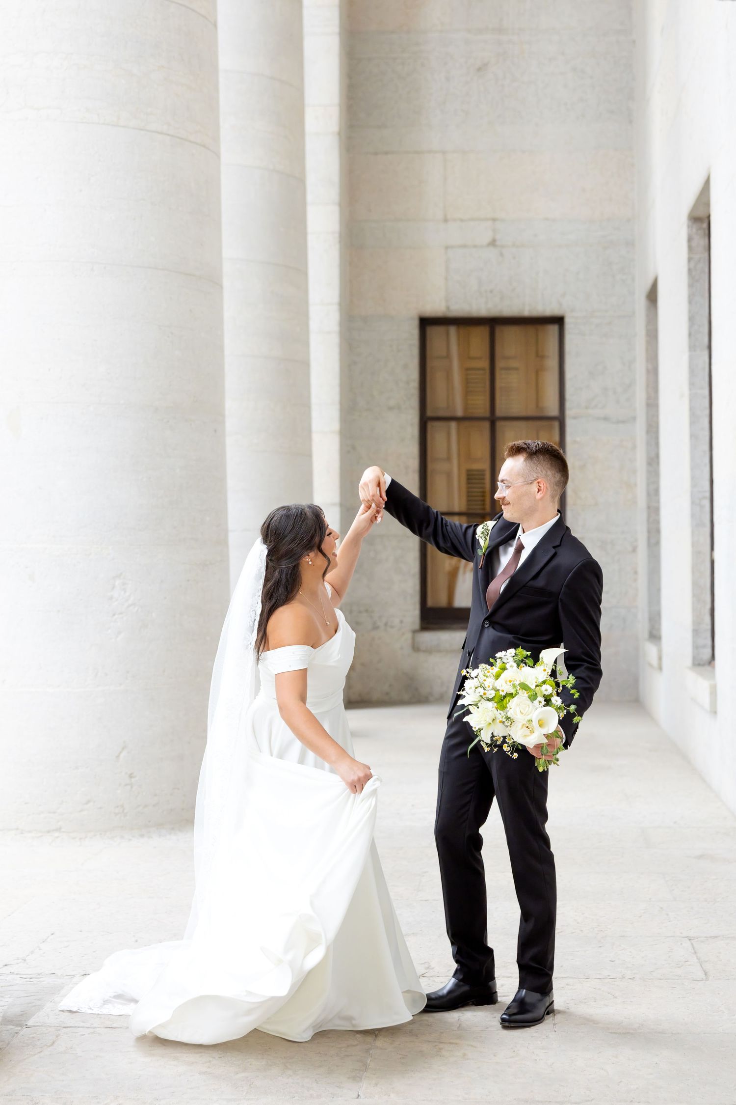 Bride and groom portraits at the Ohio Statehouse in downtown Columbus, Ohio, captured with timeless, light and airy wedding photography.
