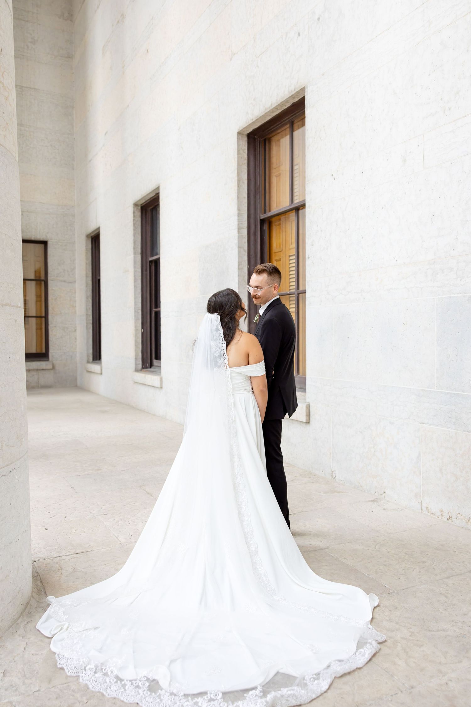 Bride and groom portraits at the Ohio Statehouse in downtown Columbus, Ohio, captured with timeless, light and airy wedding photography.