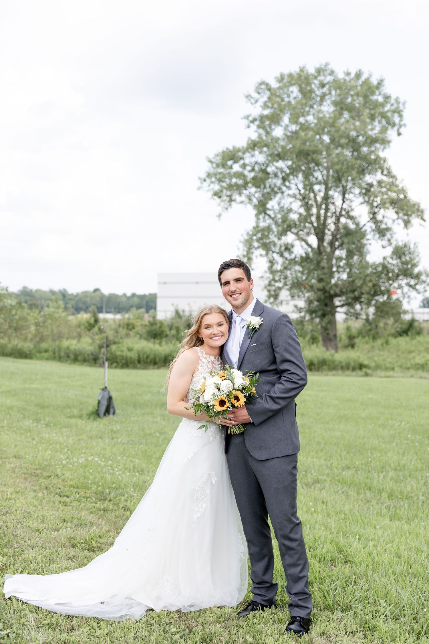 Joyful summer wedding at The Bicentennial Barn in Dayton, Ohio, photographed by Dayton wedding photographers Julia and Sean Photography.