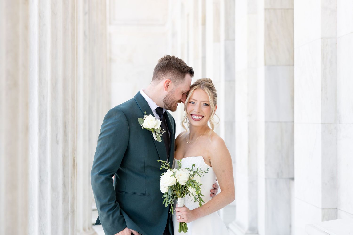 Bride and groom portraits at the Toledo Museum of Art before a Toledo Zoo wedding in Toledo, Ohio photographed by Julia & Sean Photography