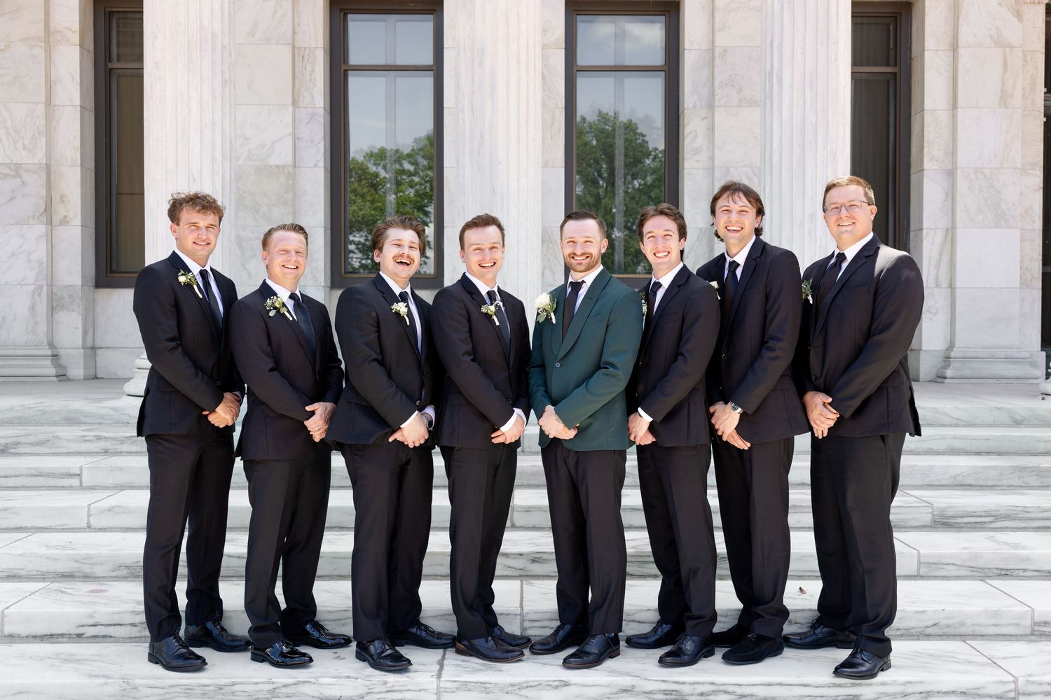 Bride and groom portraits at the Toledo Museum of Art before a Toledo Zoo wedding in Toledo, Ohio photographed by Julia & Sean Photography