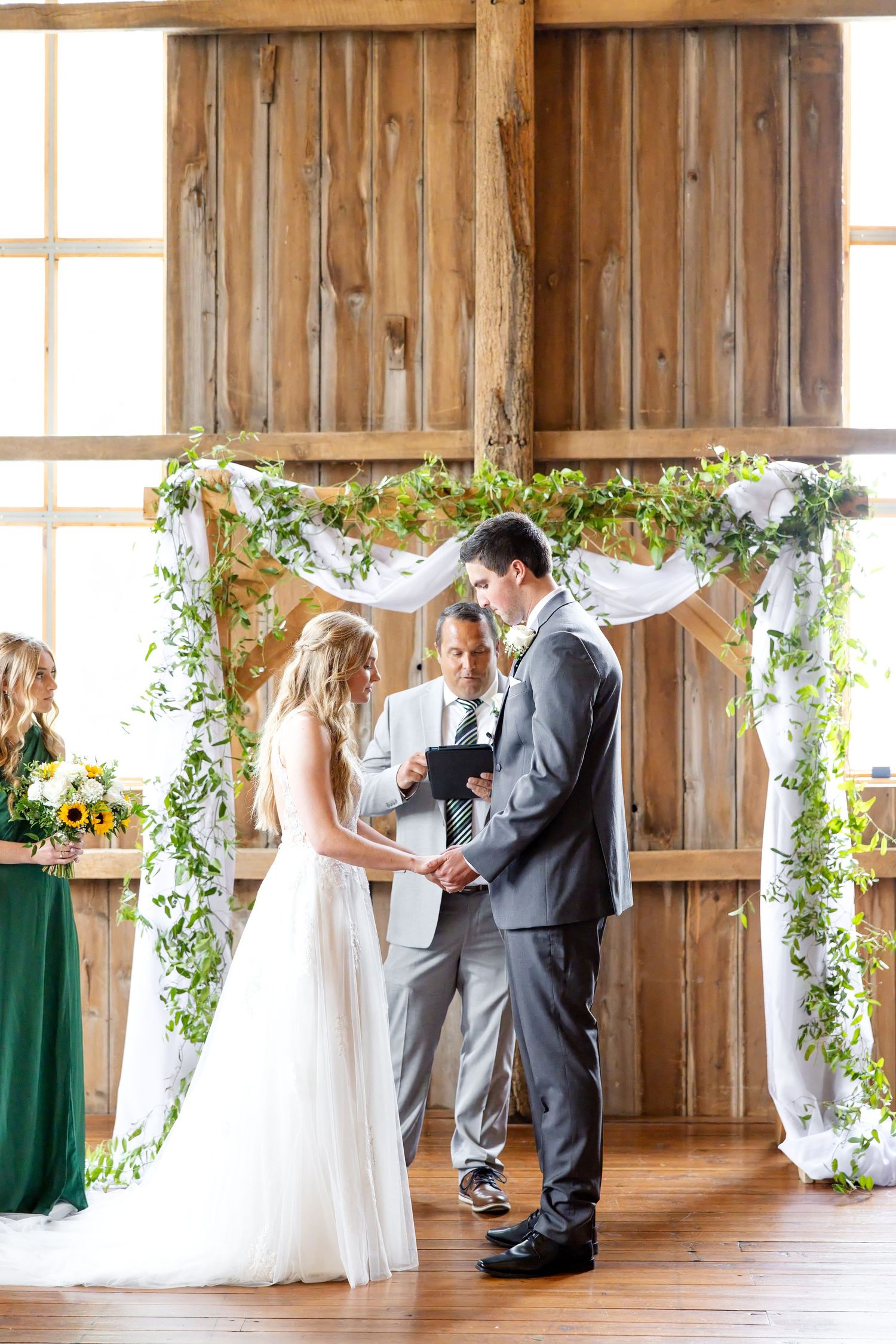 Timeless wedding photography at The Bicentennial Barn in Dayton, Ohio, featuring a joyful Cedarville University couple on their wedding day.