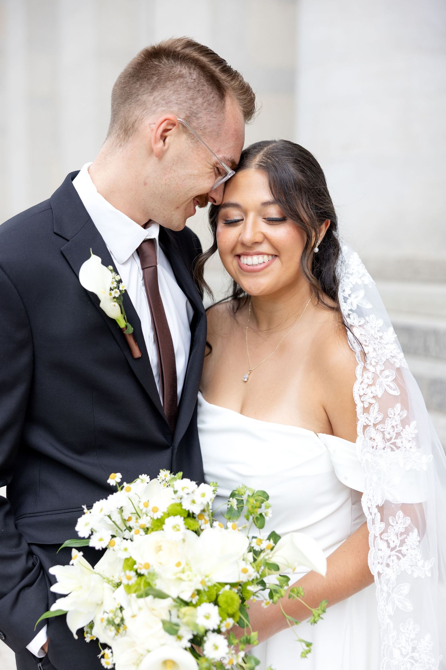 Bride and groom portraits at the Ohio Statehouse in downtown Columbus, Ohio, captured with timeless, light and airy wedding photography.