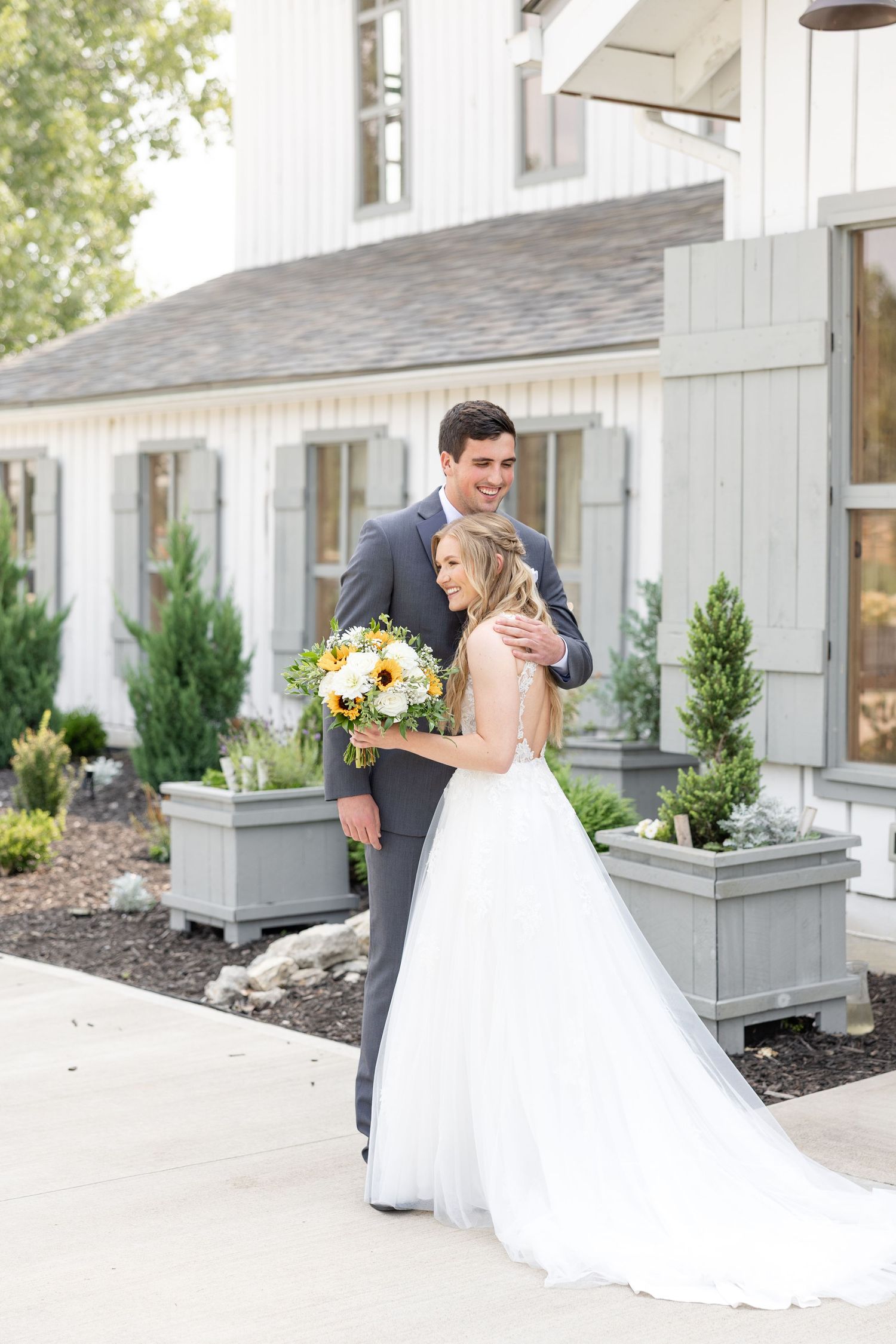 Timeless wedding photography at The Bicentennial Barn in Dayton, Ohio, featuring a joyful Cedarville University couple on their wedding day.