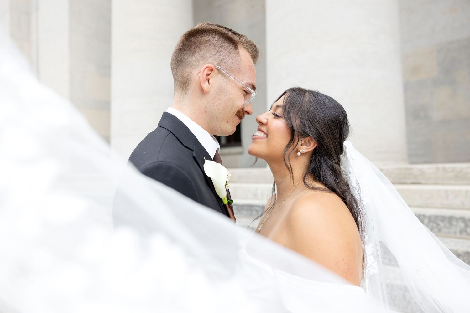 Bride and groom portraits at the Ohio Statehouse in downtown Columbus, Ohio, captured with timeless, light and airy wedding photography.