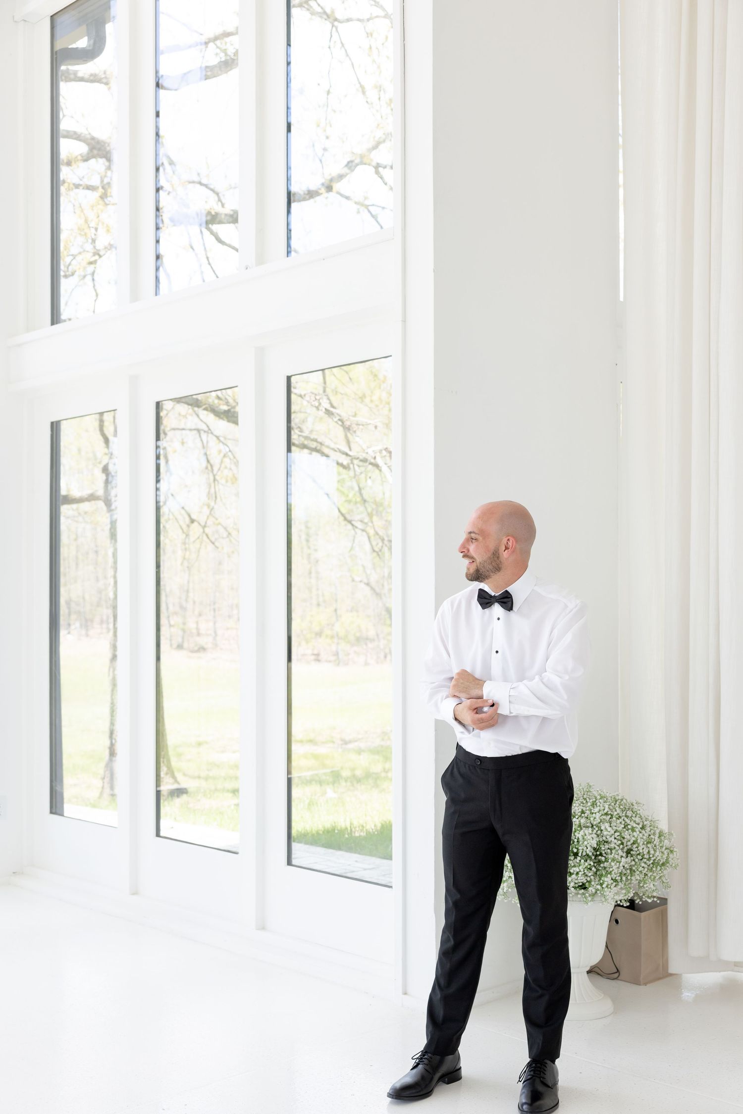 Light and airy wedding photos at The Glass House near Huntsville, Alabama capturing joyful, timeless moments of a bride and groom