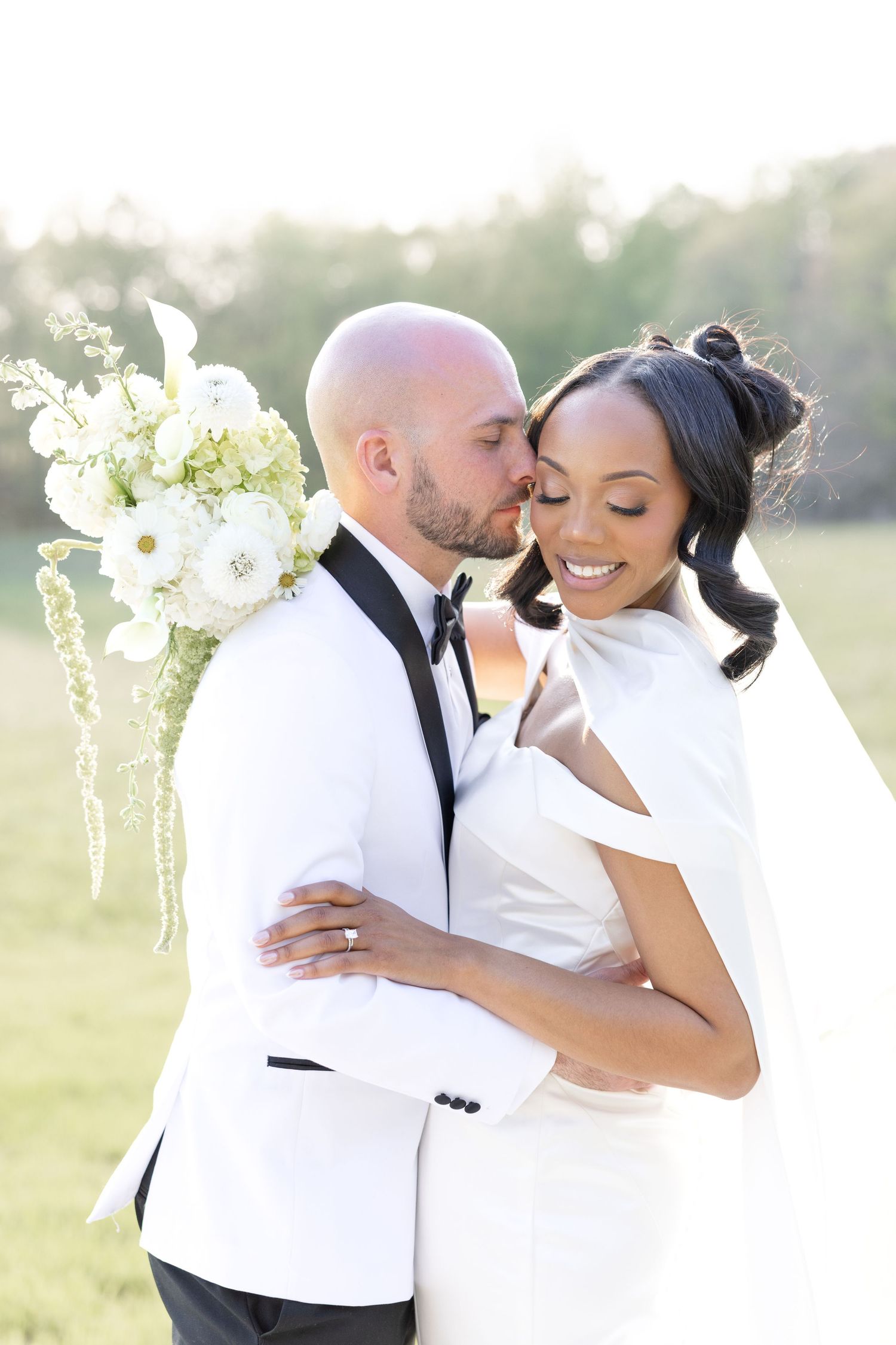 Light and airy wedding photos at The Glass House near Huntsville, Alabama capturing joyful, timeless moments of a bride and groom