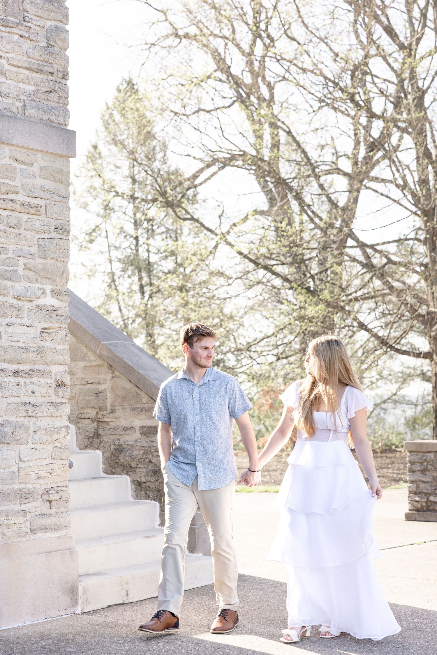 Cincinnati engagement session at Ault Park with light and airy style, capturing joyful, natural moments in a spring park setting