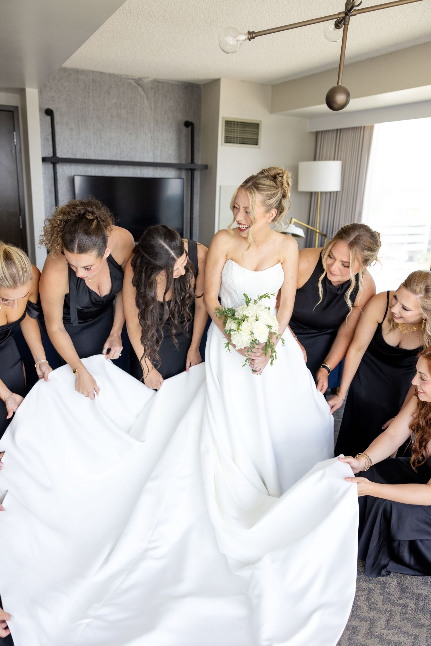 Getting ready photos at The Renaissance Hotel in downtown Toledo before a joyful Toledo Zoo wedding photographed by Julia & Sean Photography