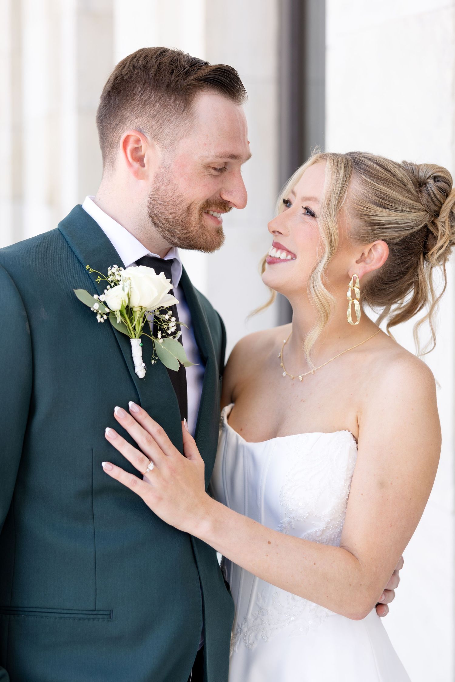 Bride and groom portraits at the Toledo Museum of Art before a Toledo Zoo wedding in Toledo, Ohio photographed by Julia & Sean Photography