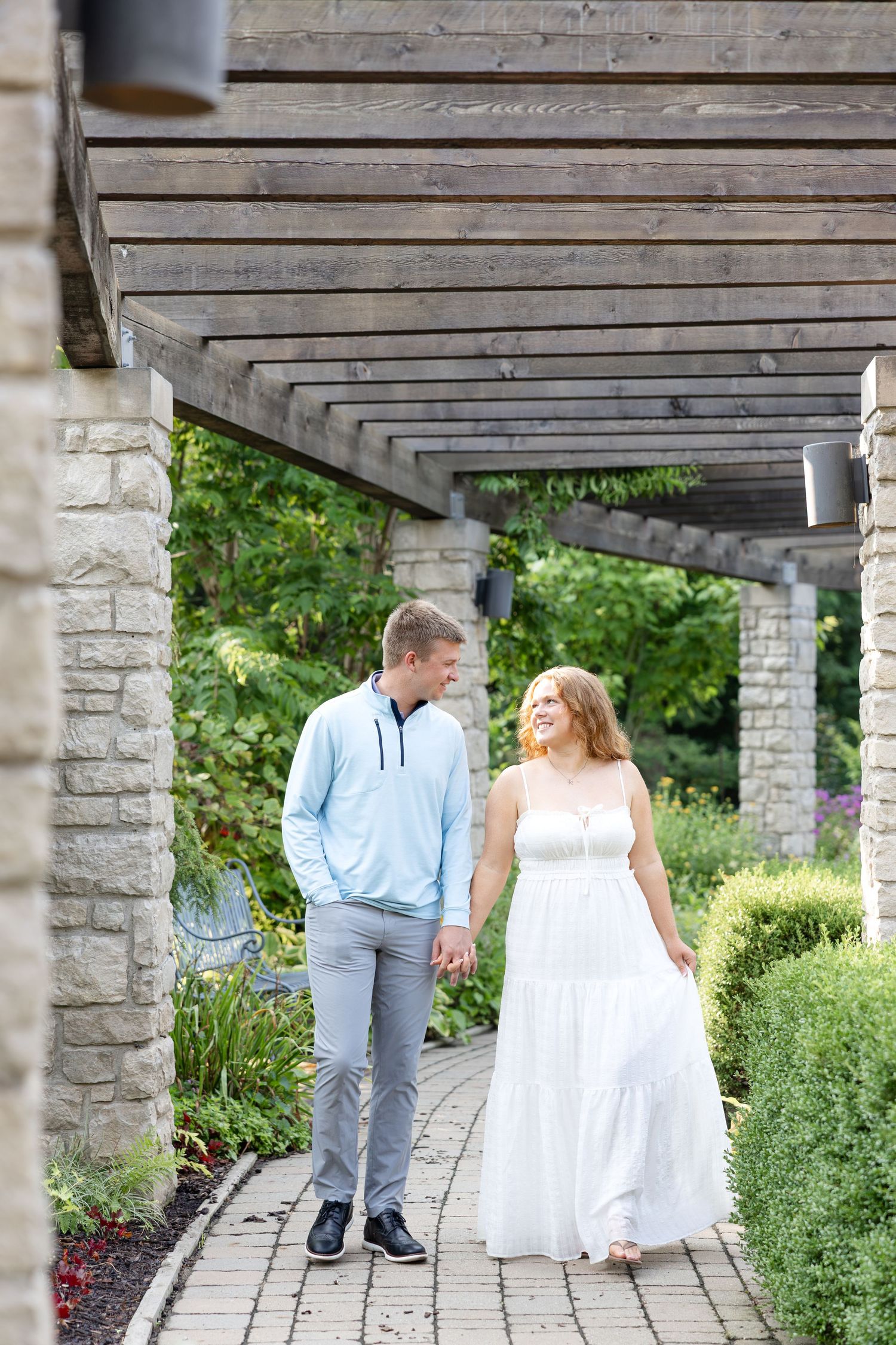 Joyful engagement photos at Wegerzyn Gardens captured by a Dayton engagement photographer with beautiful gardens and natural morning light.