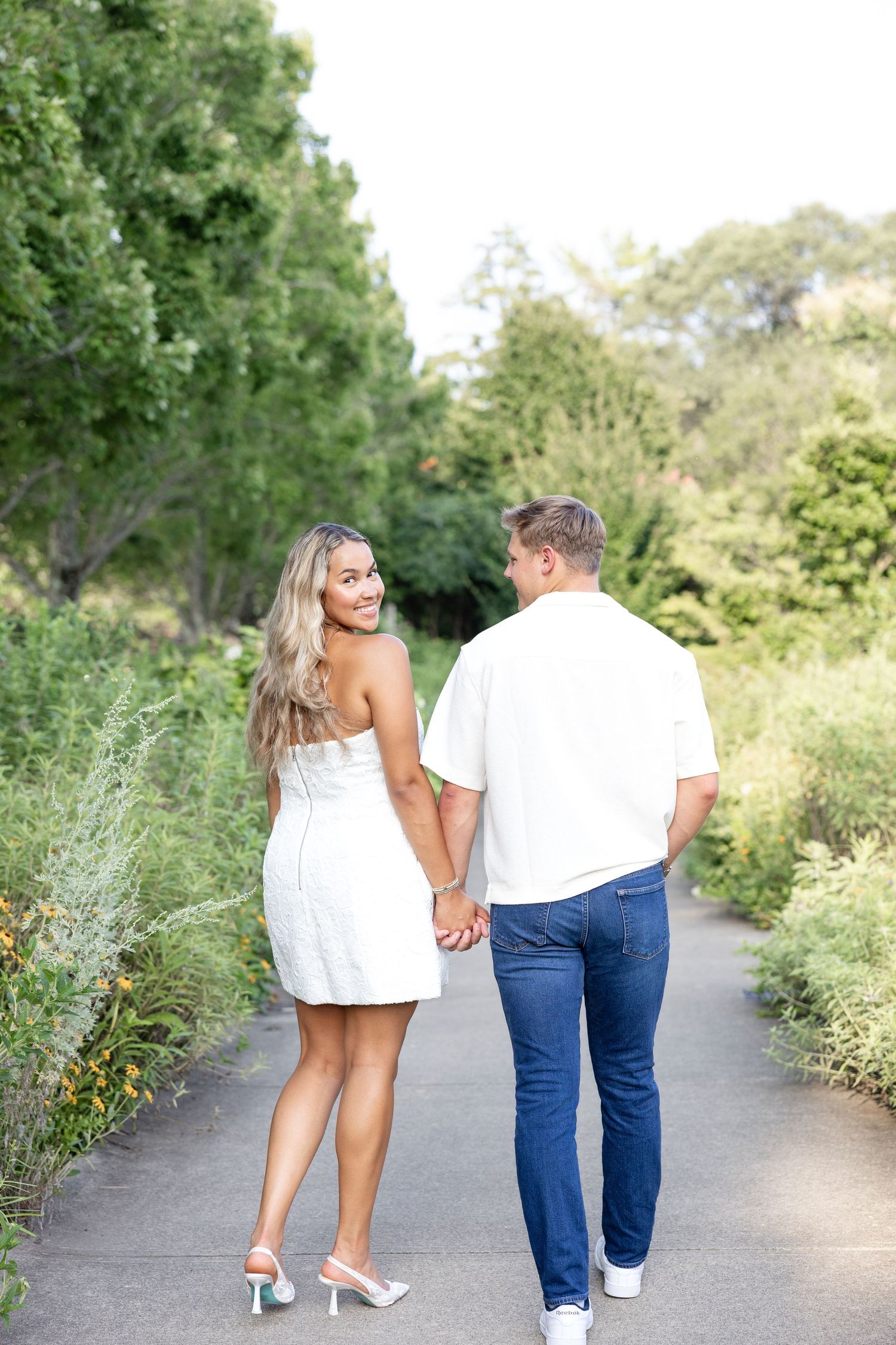 Romantic Ault Park engagement photos in Cincinnati, Ohio by Julia & Sean Photography, capturing a joyful couple during a golden hour engagem