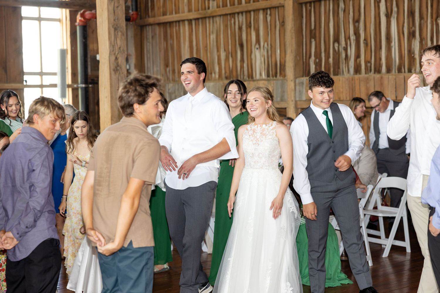 Joyful summer wedding at The Bicentennial Barn in Dayton, Ohio, photographed by Dayton wedding photographers Julia and Sean Photography.