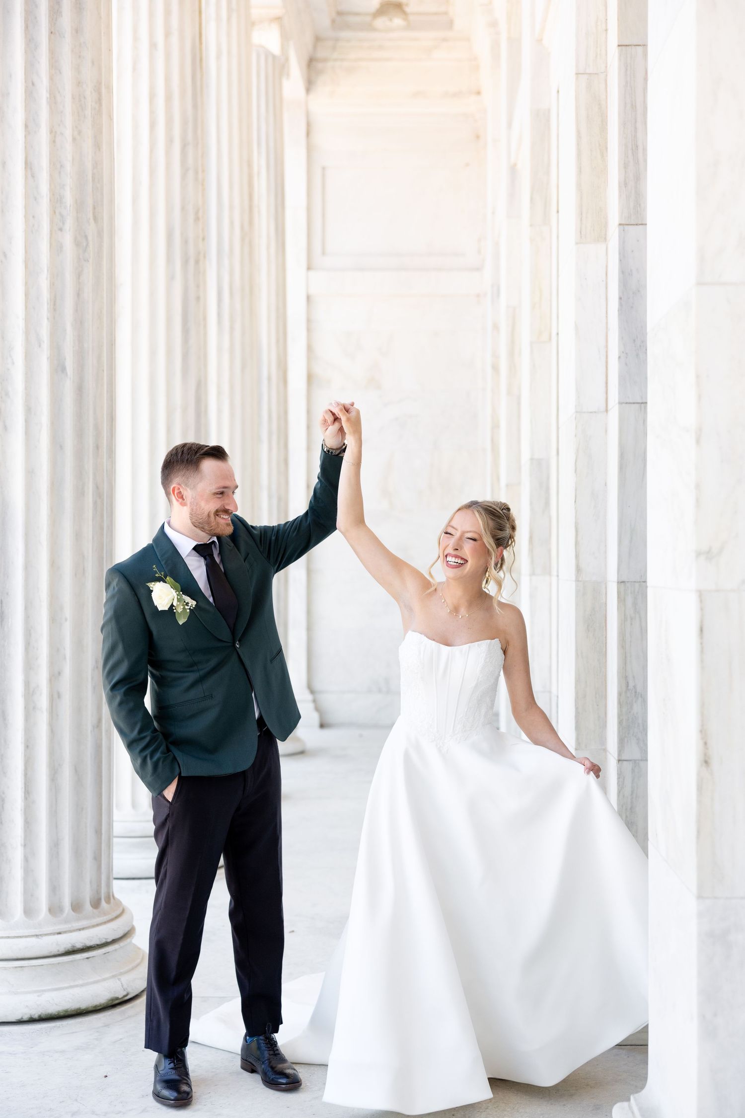 Bride and groom portraits at the Toledo Museum of Art before a Toledo Zoo wedding in Toledo, Ohio photographed by Julia & Sean Photography