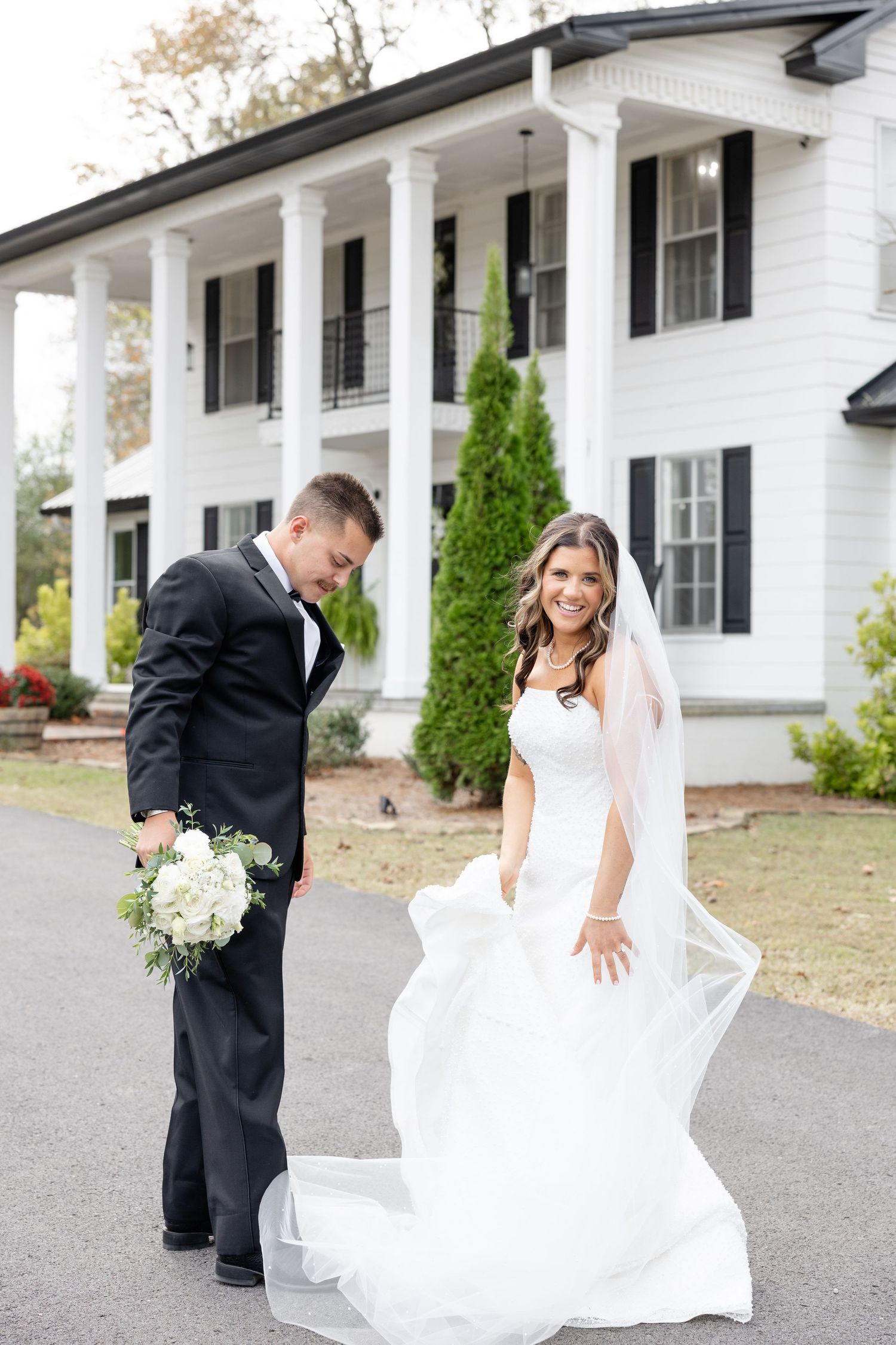 Elegant wedding at The Upton House in Guntersville, Alabama featuring a joyful bride and groom and timeless southern elegance.