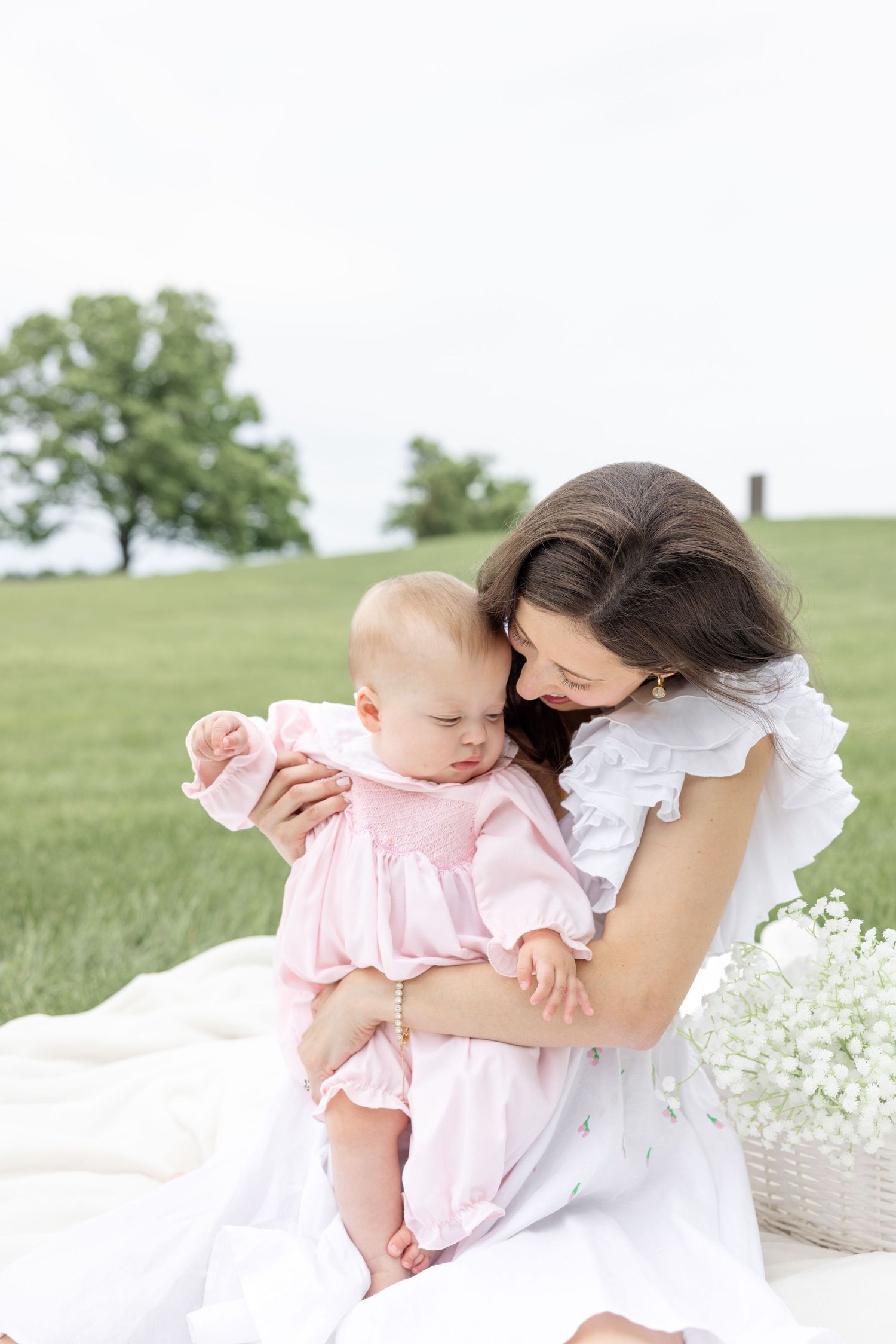 Mother holding her baby during a timeless motherhood session at Carillon Park in Dayton Ohio with Julia and Sean Photography