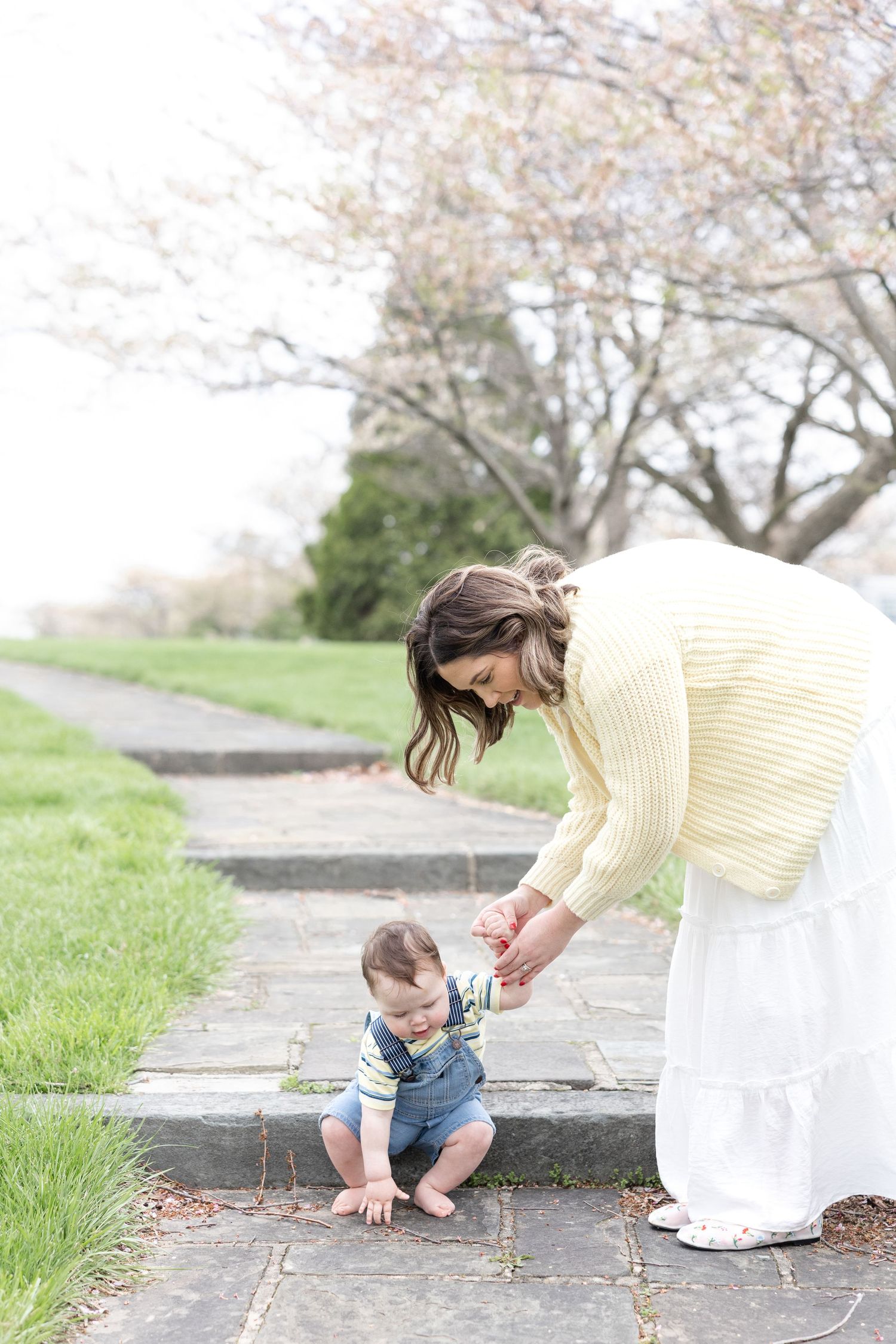 Joyful motherhood photos at Carillon Park in Dayton Ohio captured by Julia and Sean Photography during a soft spring day
