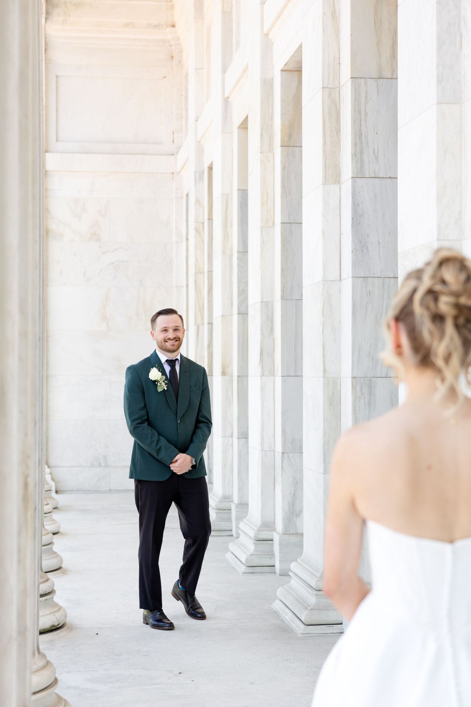 Bride and groom portraits at the Toledo Museum of Art before a Toledo Zoo wedding in Toledo, Ohio photographed by Julia & Sean Photography