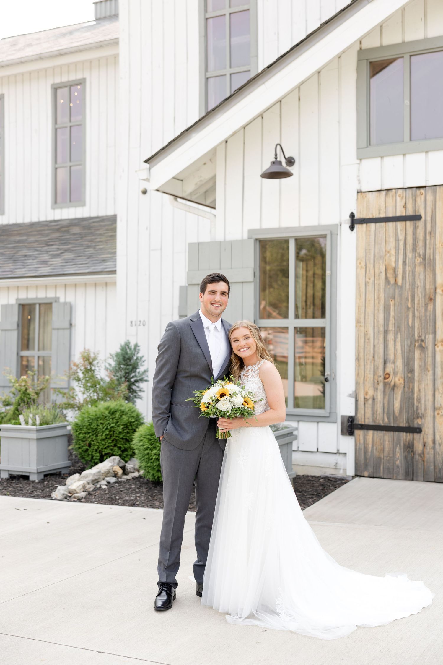 Joyful summer wedding at The Bicentennial Barn in Dayton, Ohio, photographed by Dayton wedding photographers Julia and Sean Photography.