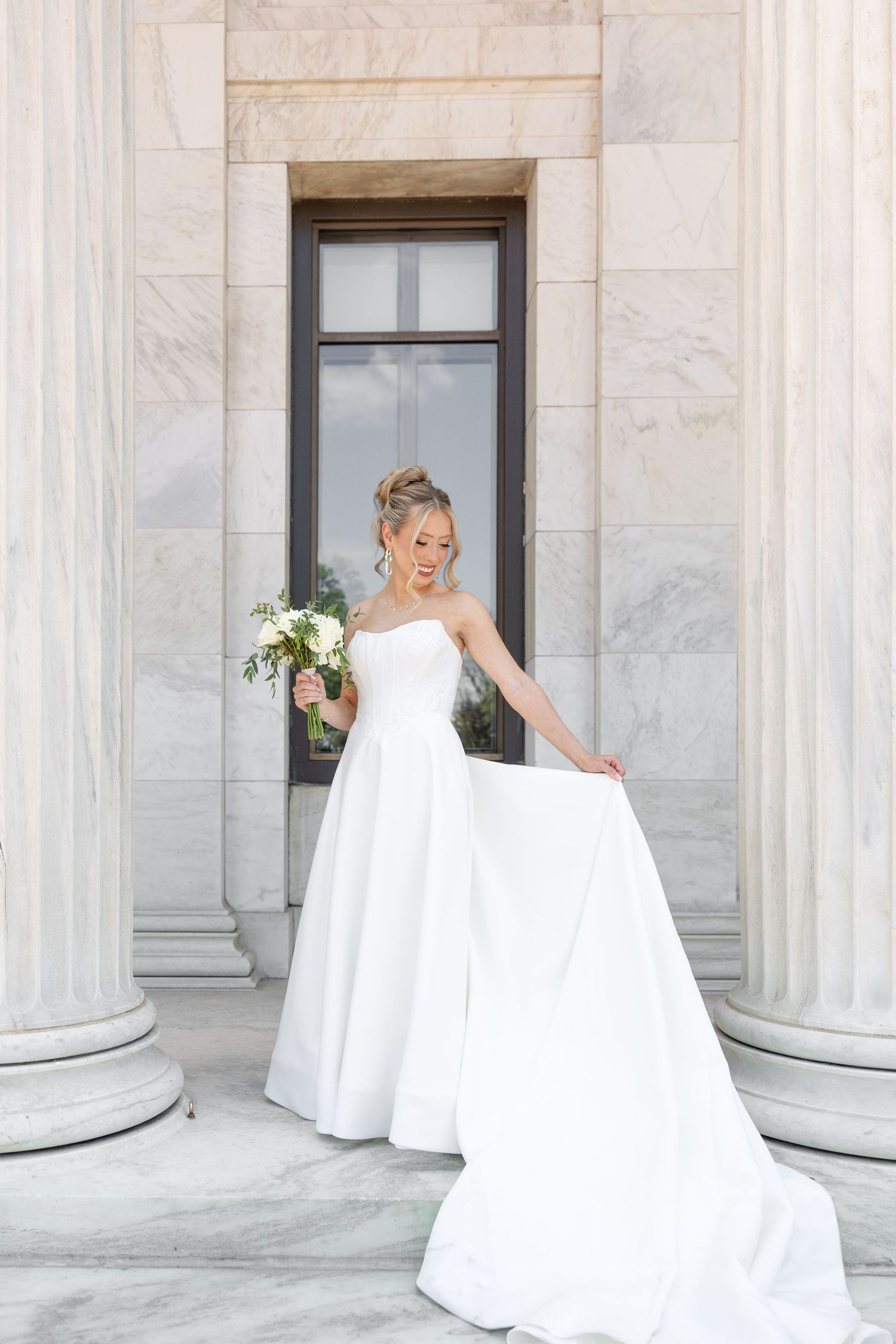 Bride and groom portraits at the Toledo Museum of Art before a Toledo Zoo wedding in Toledo, Ohio photographed by Julia & Sean Photography