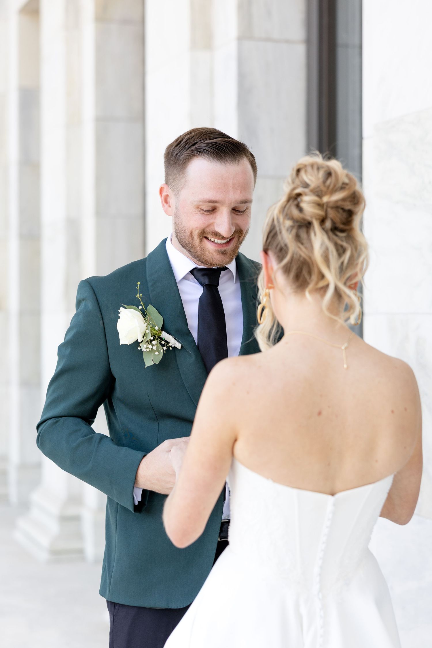 Bride and groom portraits at the Toledo Museum of Art before a Toledo Zoo wedding in Toledo, Ohio photographed by Julia & Sean Photography