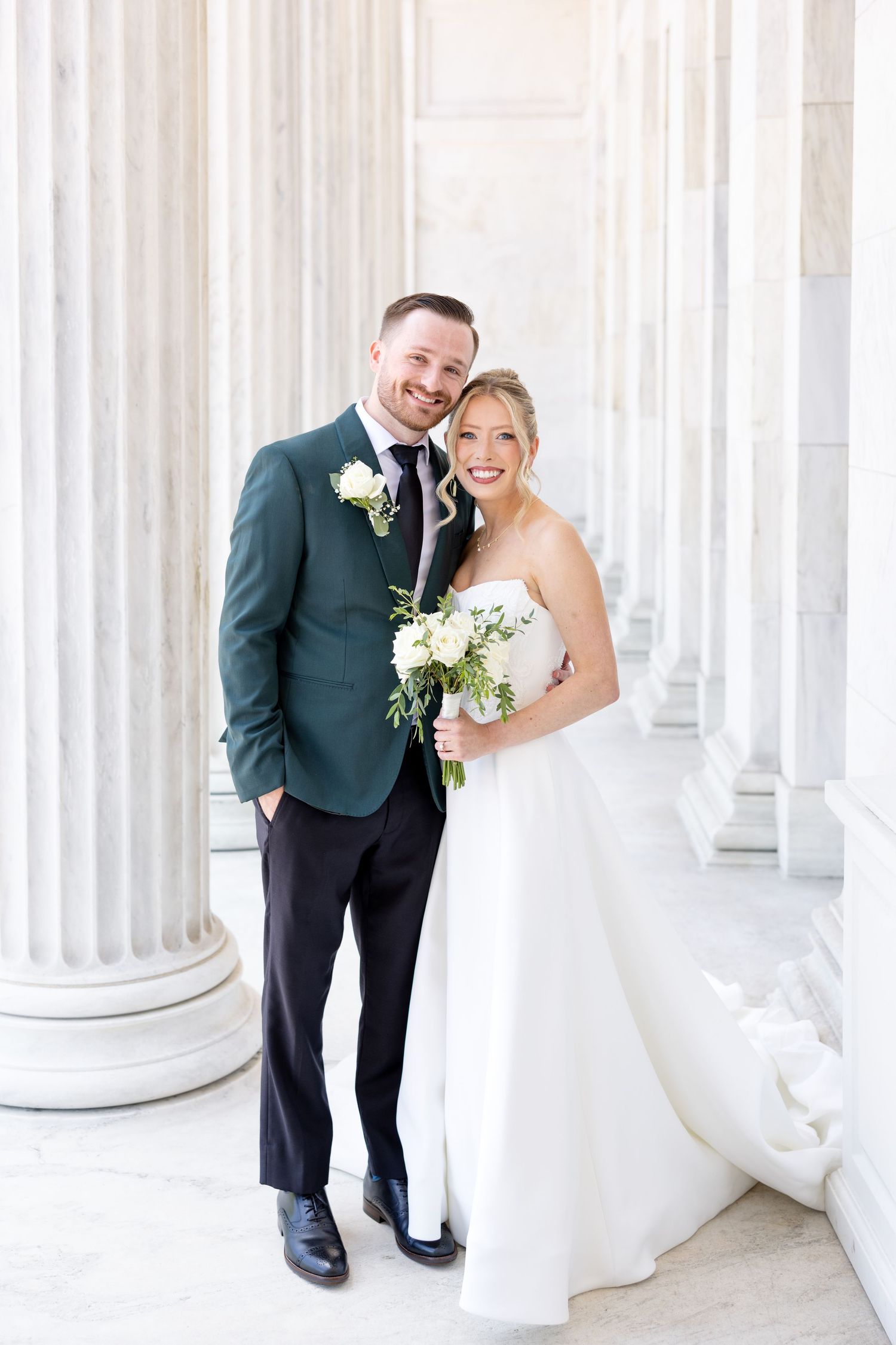 Bride and groom portraits at the Toledo Museum of Art before a Toledo Zoo wedding in Toledo, Ohio photographed by Julia & Sean Photography