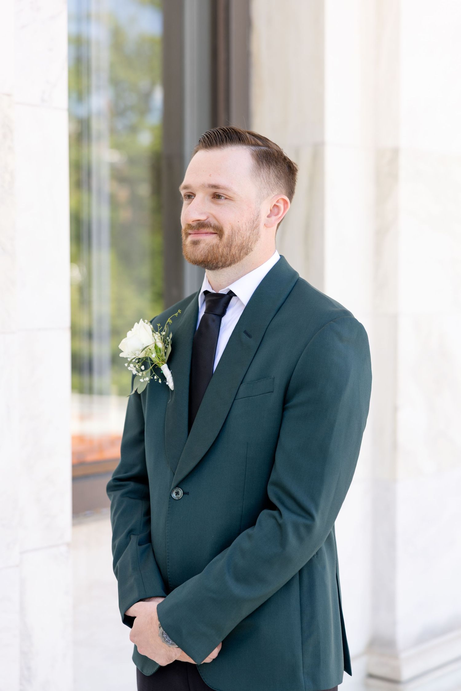 Bride and groom portraits at the Toledo Museum of Art before a Toledo Zoo wedding in Toledo, Ohio photographed by Julia & Sean Photography