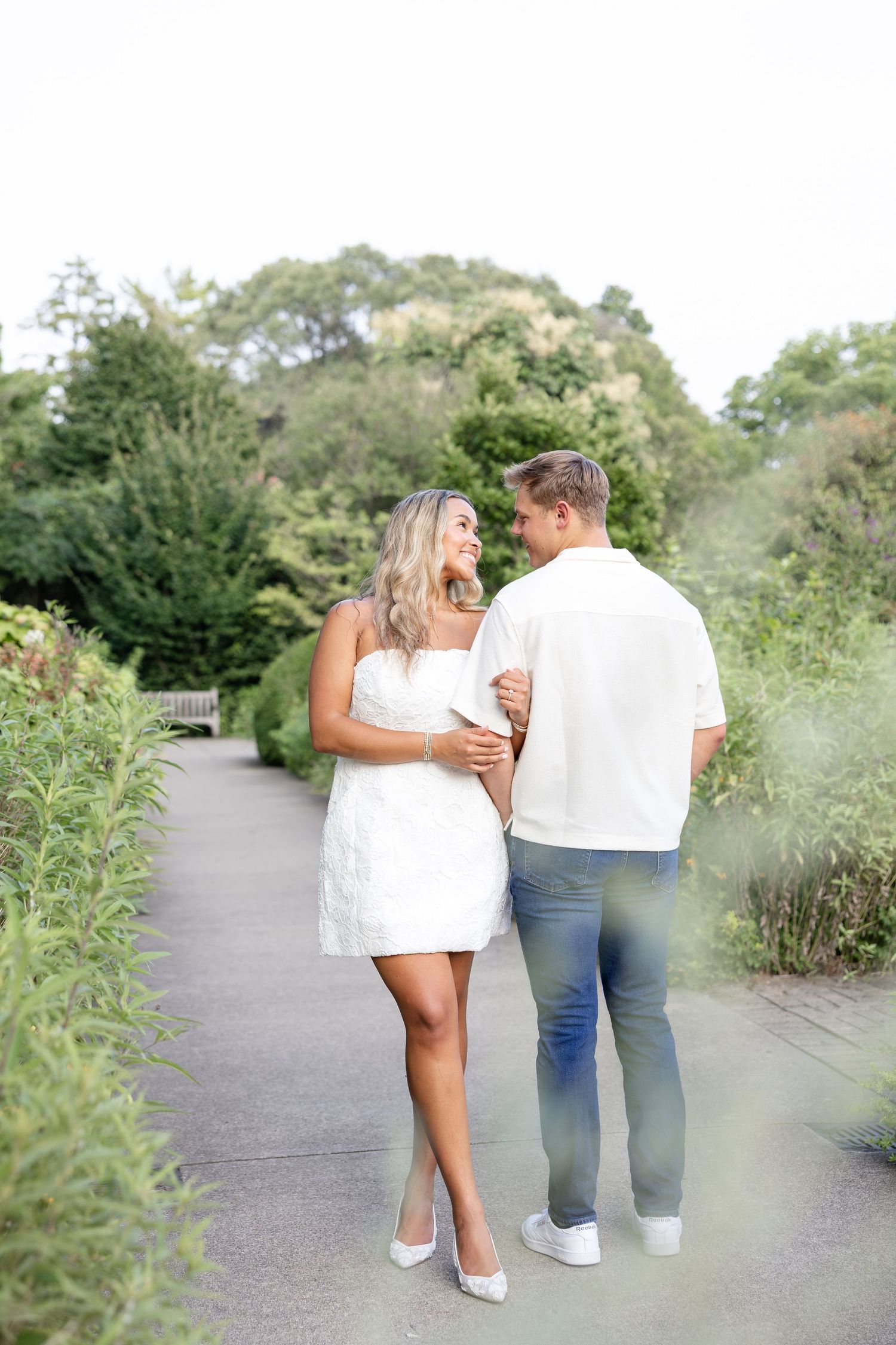 Romantic Ault Park engagement photos in Cincinnati, Ohio by Julia & Sean Photography, capturing a joyful couple during a golden hour engagem