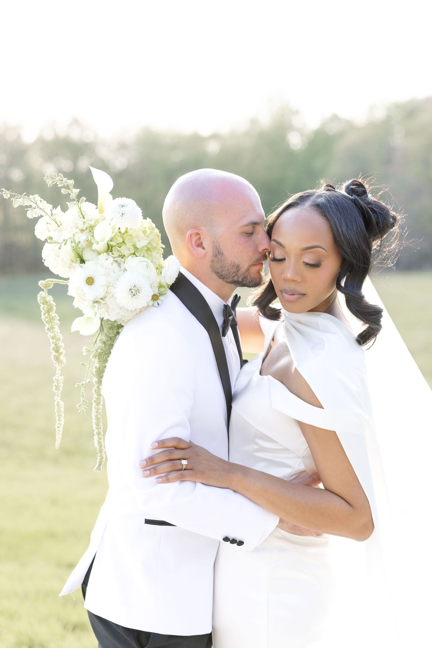 Light and airy wedding photos at The Glass House near Huntsville, Alabama capturing joyful, timeless moments of a bride and groom