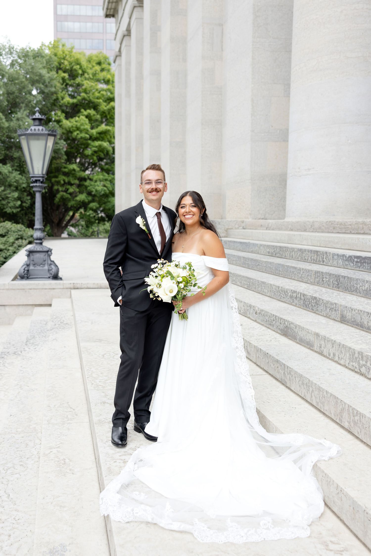 Bride and groom portraits at the Ohio Statehouse in downtown Columbus, Ohio, captured with timeless, light and airy wedding photography.