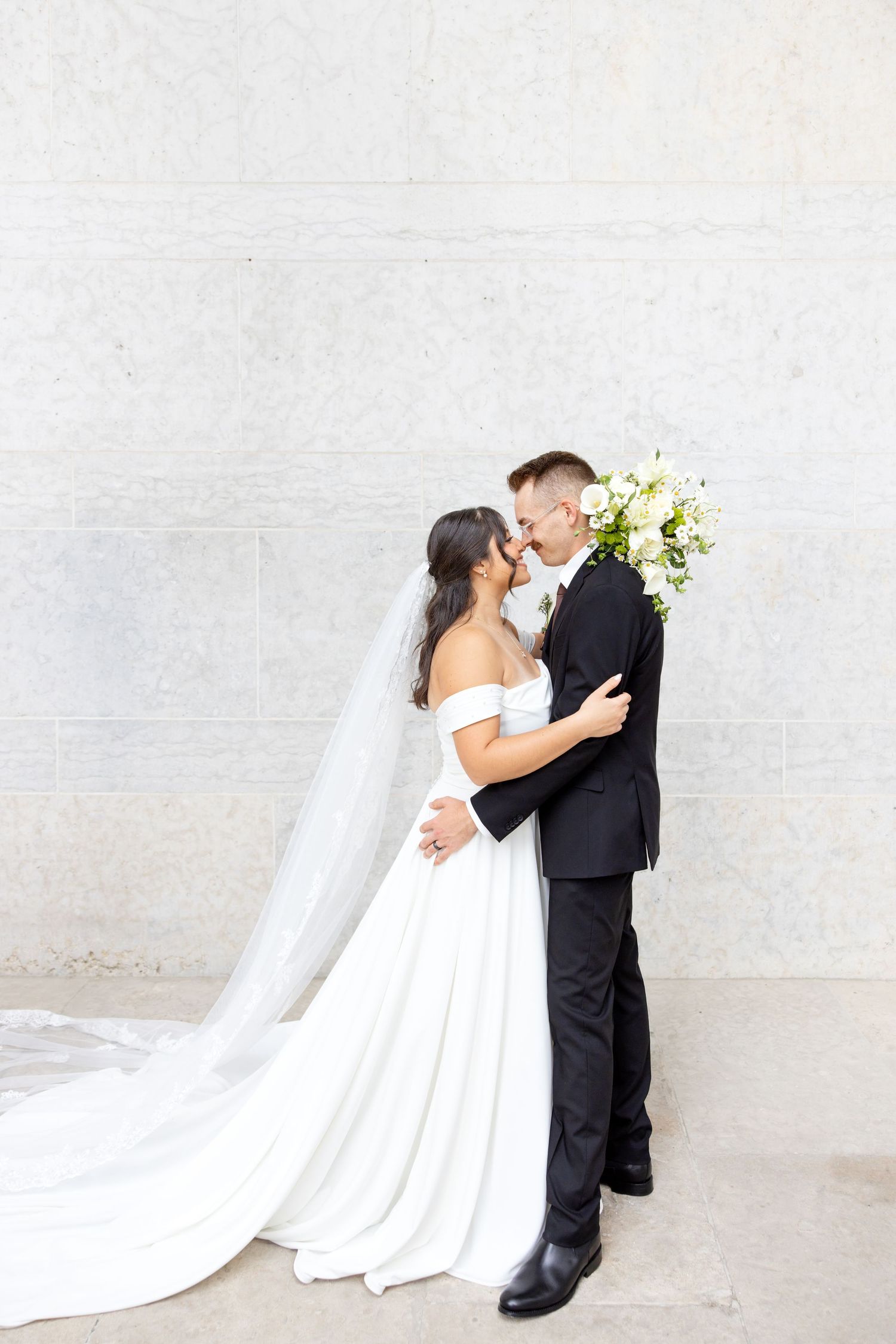 Bride and groom portraits at the Ohio Statehouse in downtown Columbus, Ohio, captured with timeless, light and airy wedding photography.