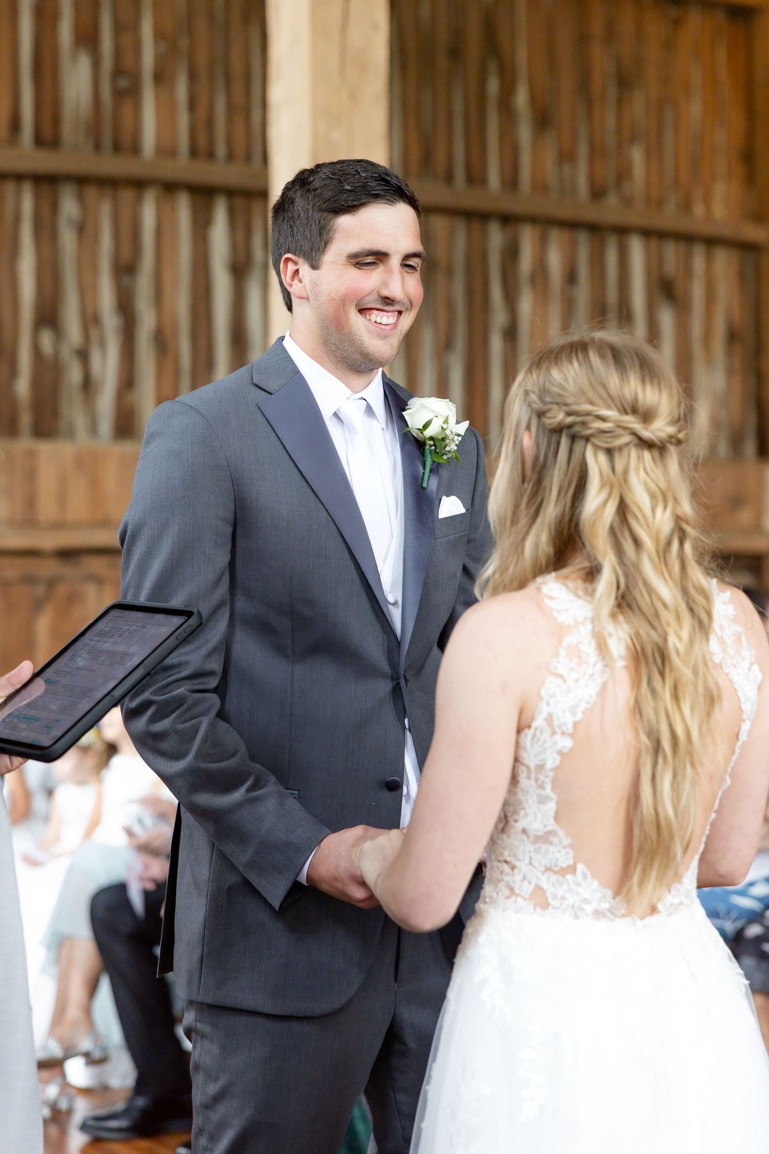 Timeless wedding photography at The Bicentennial Barn in Dayton, Ohio, featuring a joyful Cedarville University couple on their wedding day.