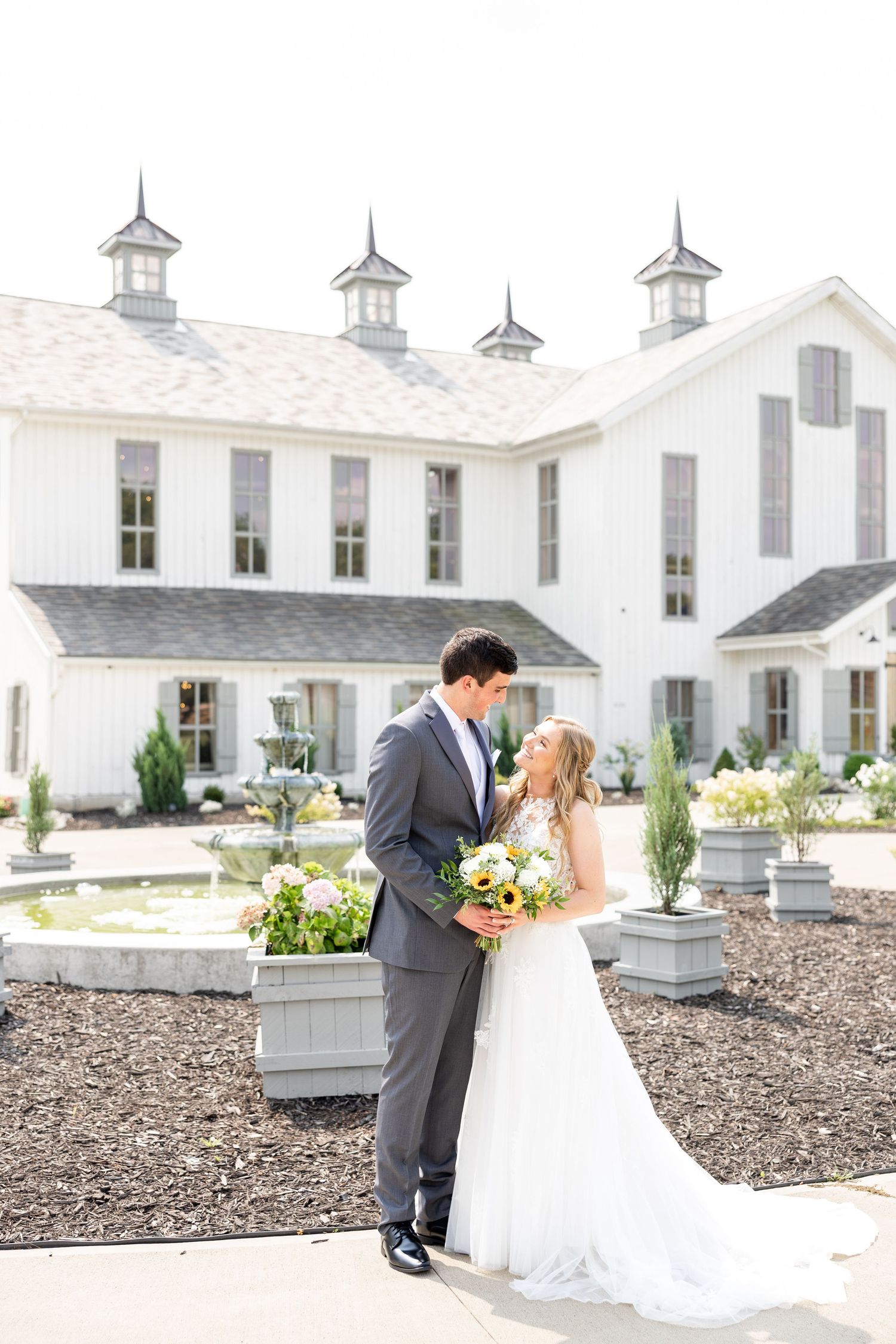 Joyful summer wedding at The Bicentennial Barn in Dayton, Ohio, photographed by Dayton wedding photographers Julia and Sean Photography.