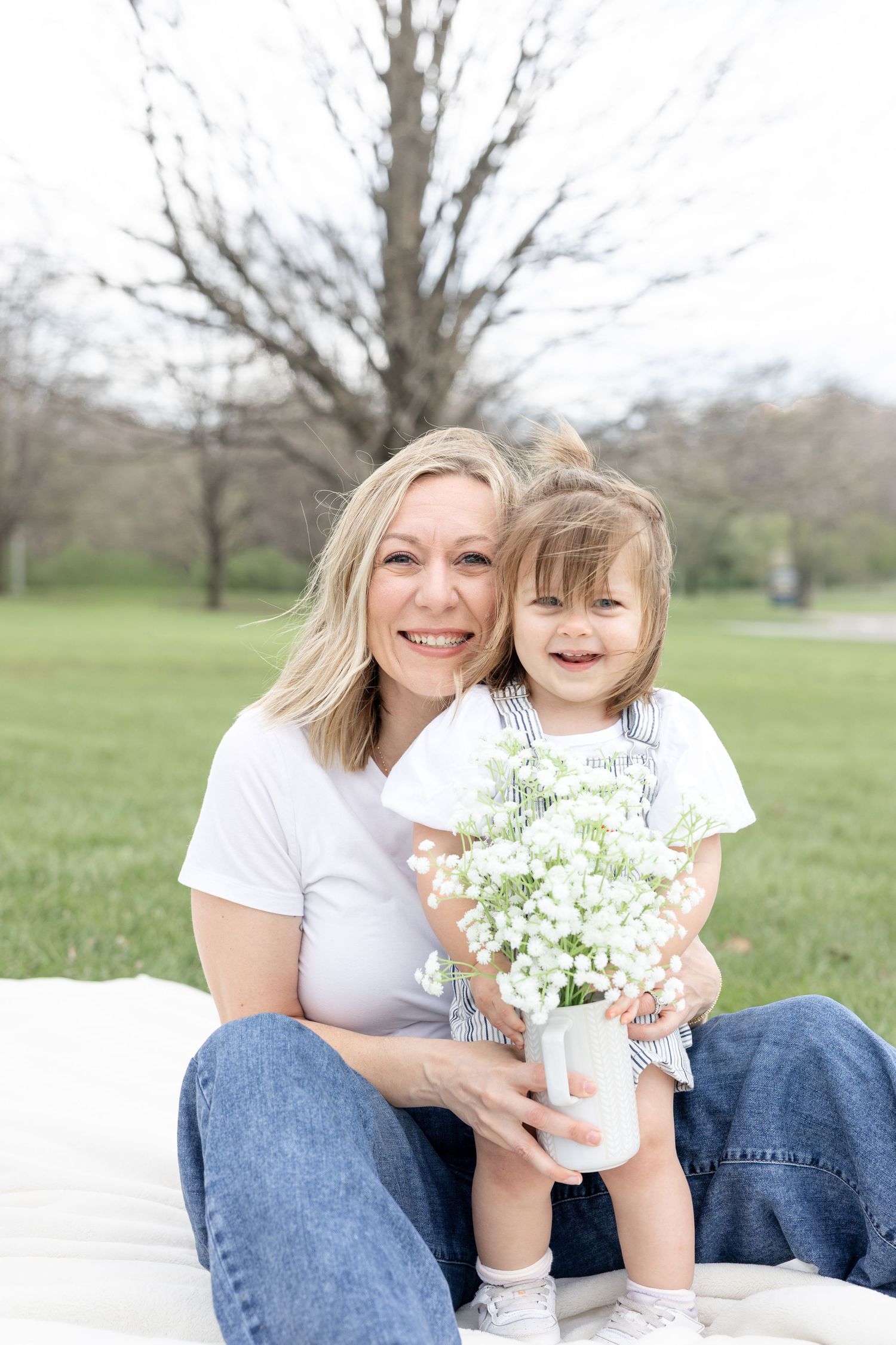 Mother holding her baby during a timeless motherhood session at Carillon Park in Dayton Ohio with Julia and Sean Photography
