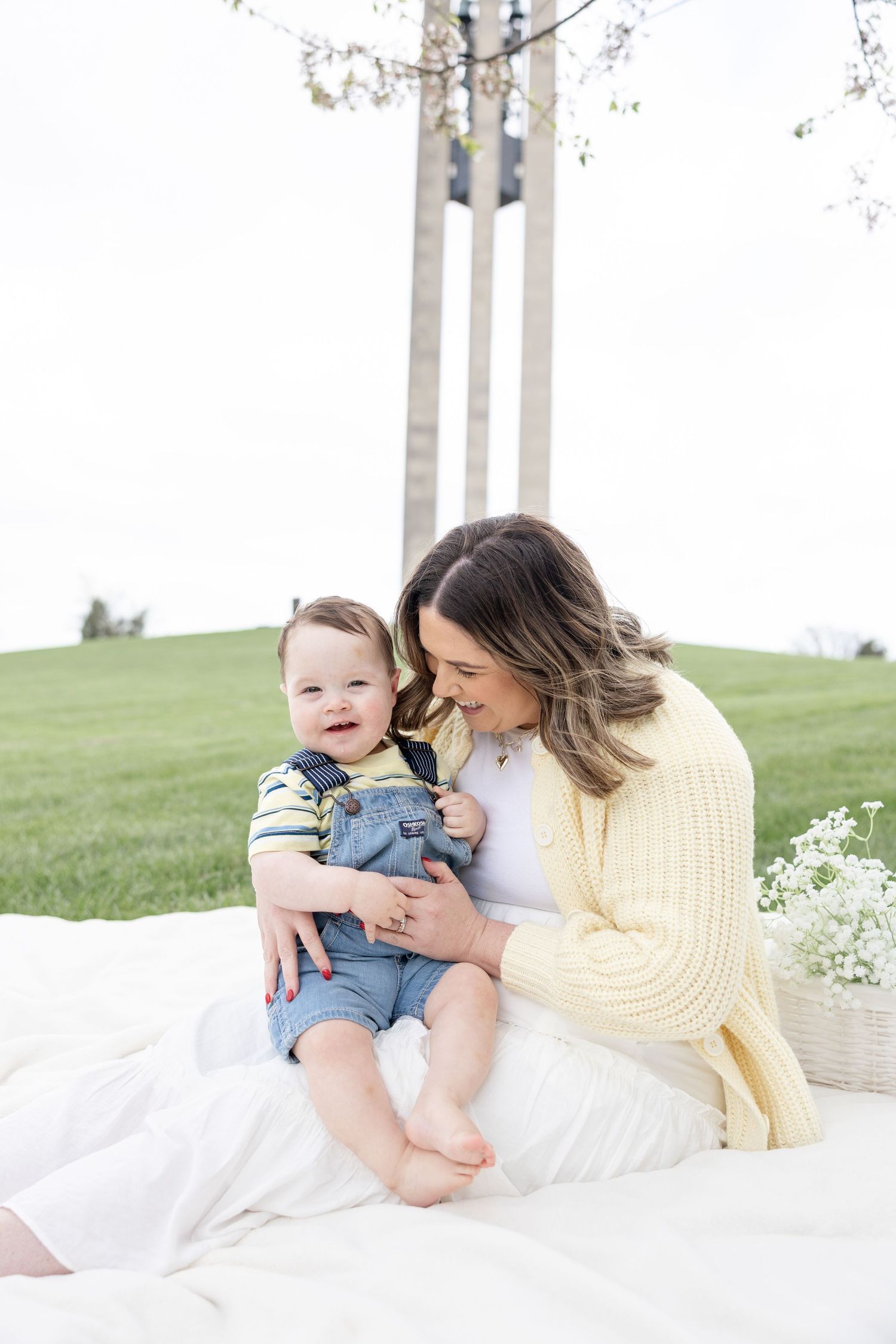 Mother holding her baby during a timeless motherhood session at Carillon Park in Dayton Ohio with Julia and Sean Photography