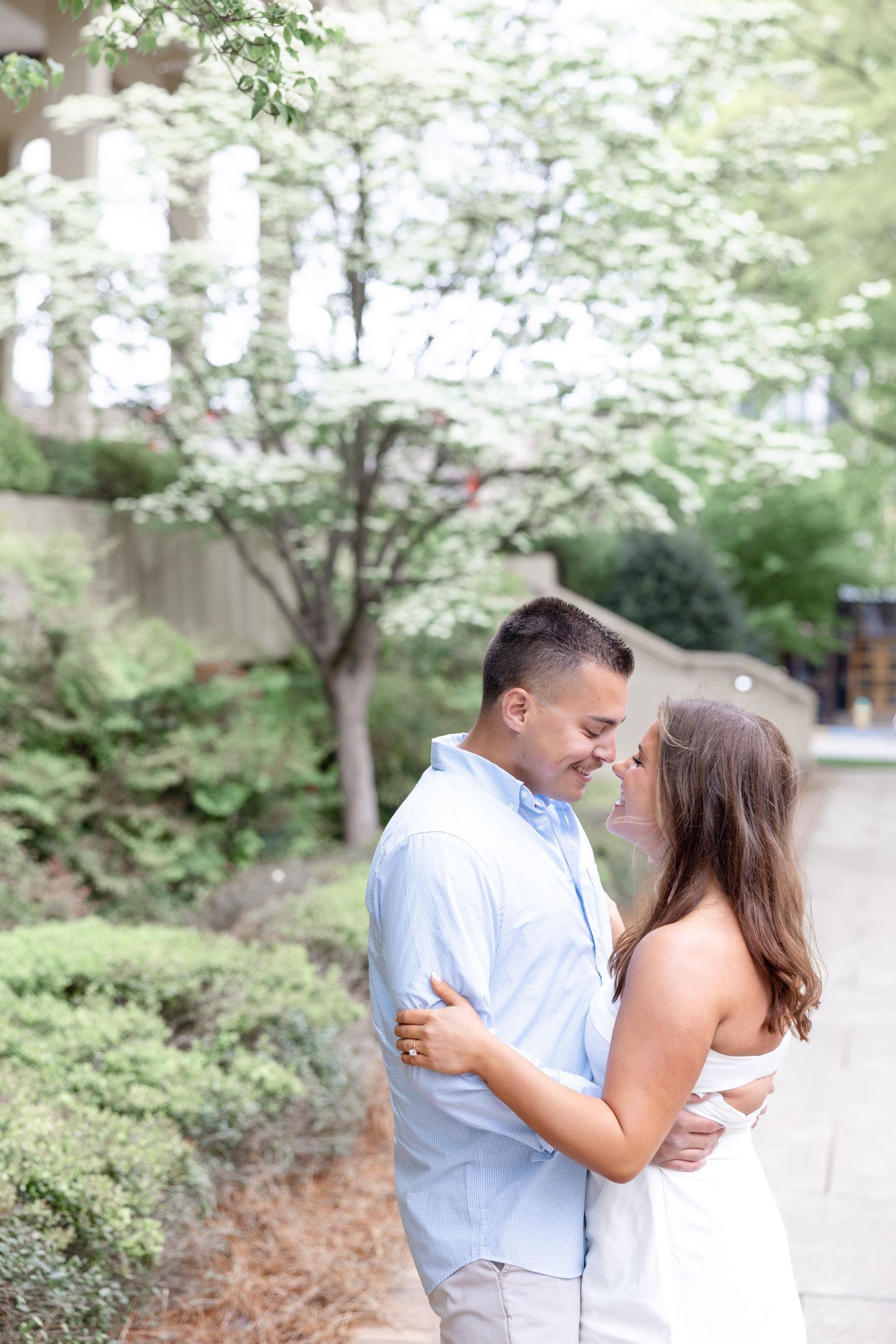 Downtown Huntsville engagement session at First National Bank and Big Spring Park by Julia and Sean Photography, capturing joyful moments.