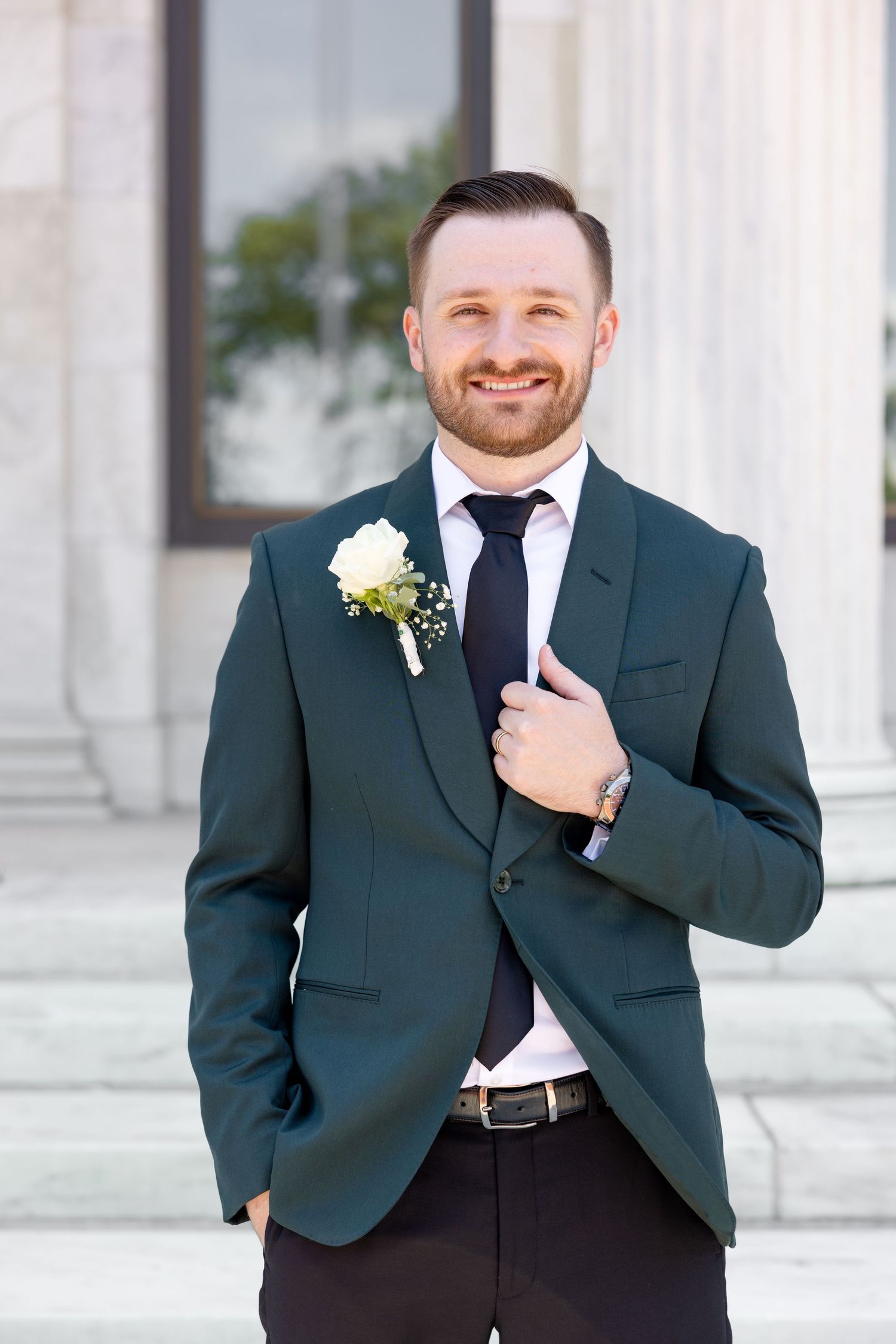 Bride and groom portraits at the Toledo Museum of Art before a Toledo Zoo wedding in Toledo, Ohio photographed by Julia & Sean Photography