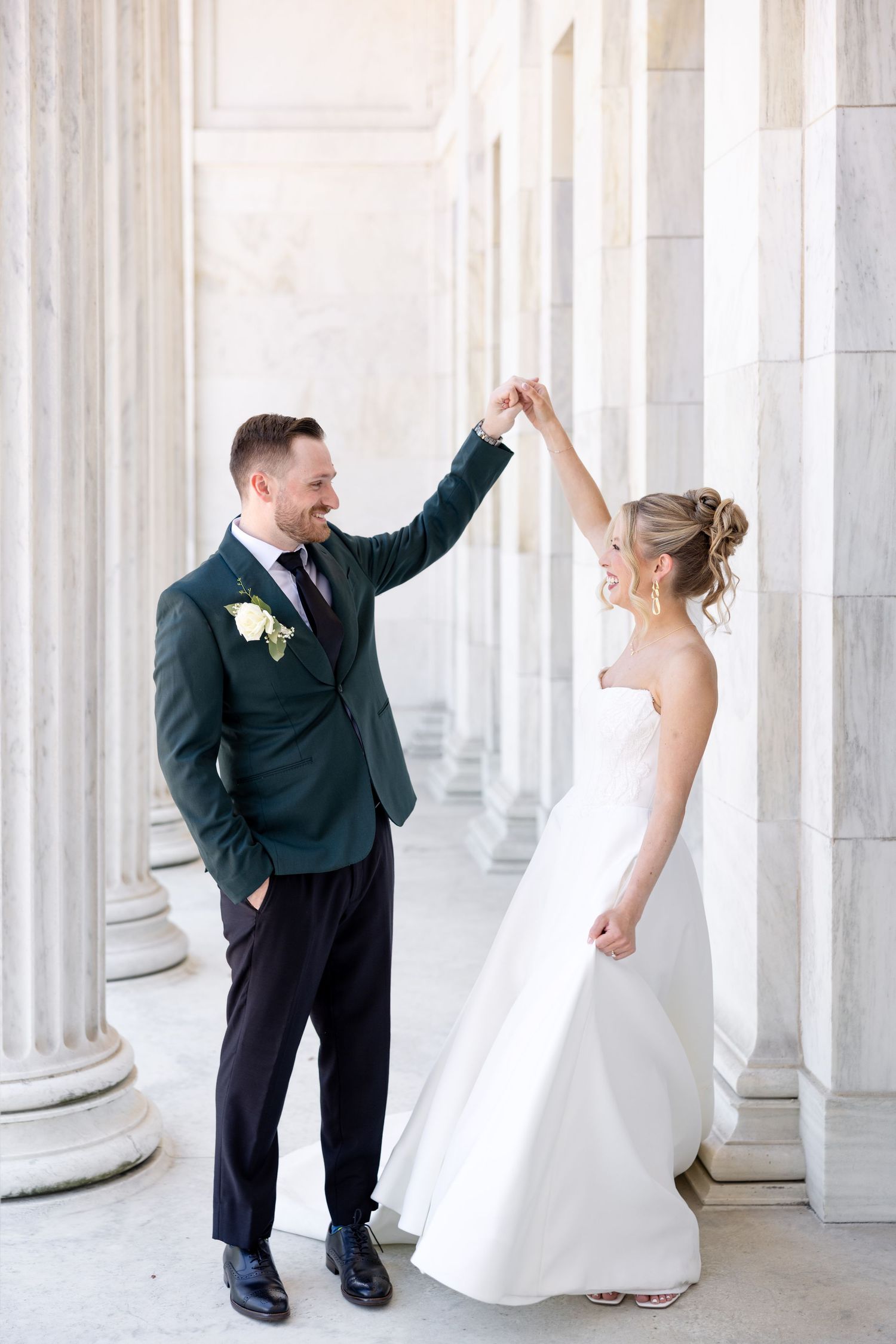 Bride and groom portraits at the Toledo Museum of Art before a Toledo Zoo wedding in Toledo, Ohio photographed by Julia & Sean Photography