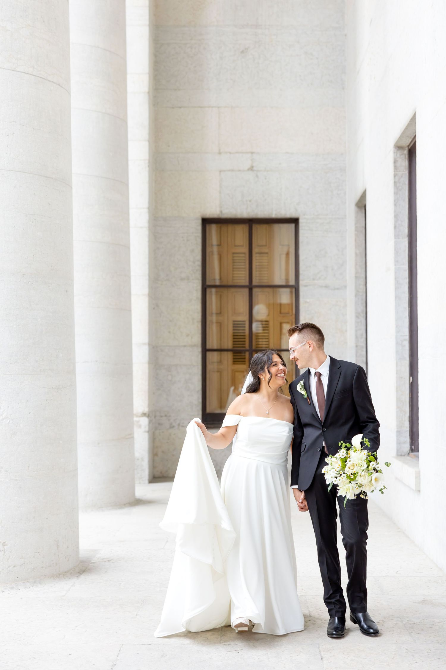 Bride and groom portraits at the Ohio Statehouse in downtown Columbus, Ohio, captured with timeless, light and airy wedding photography.