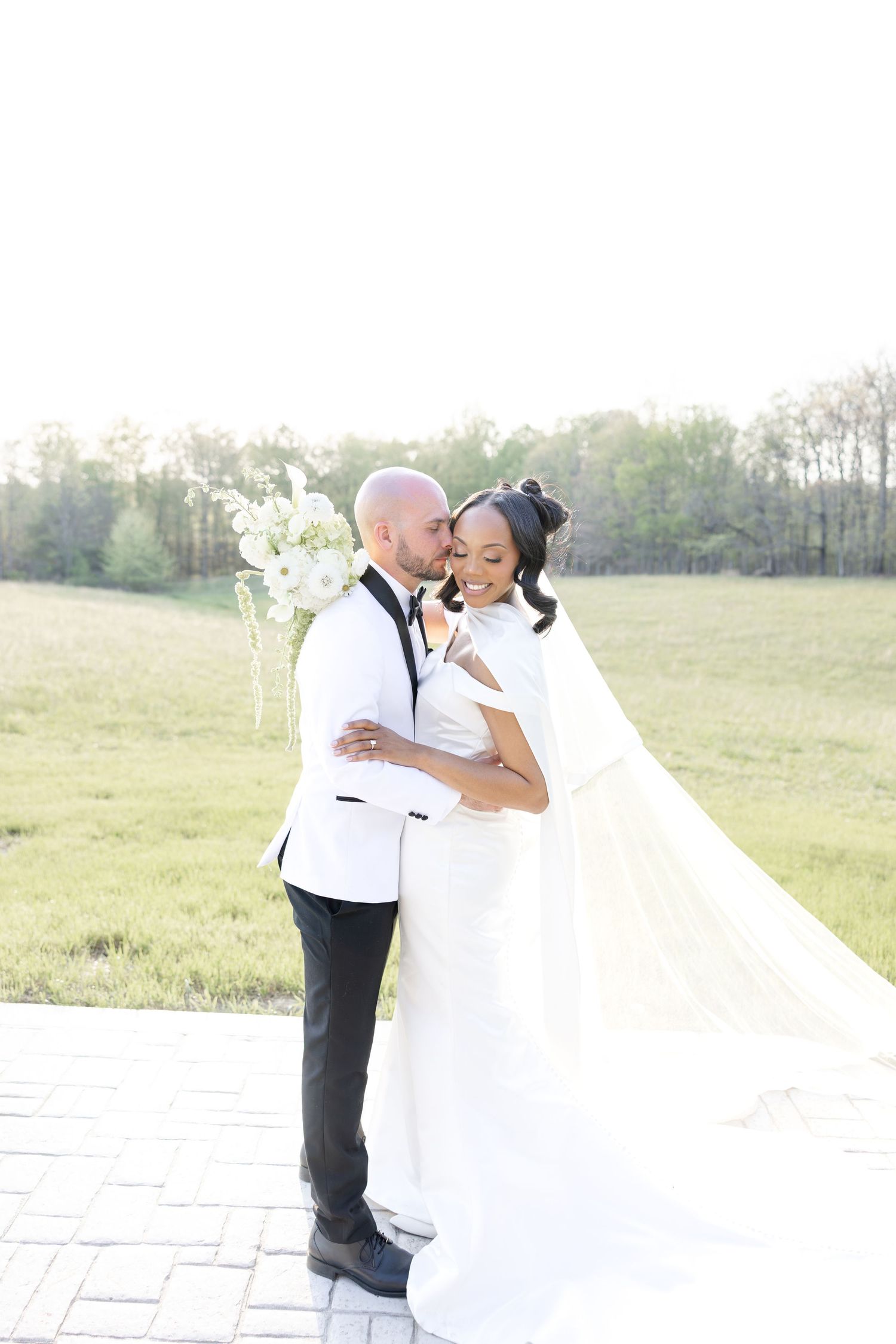 Light and airy wedding photos at The Glass House near Huntsville, Alabama capturing joyful, timeless moments of a bride and groom